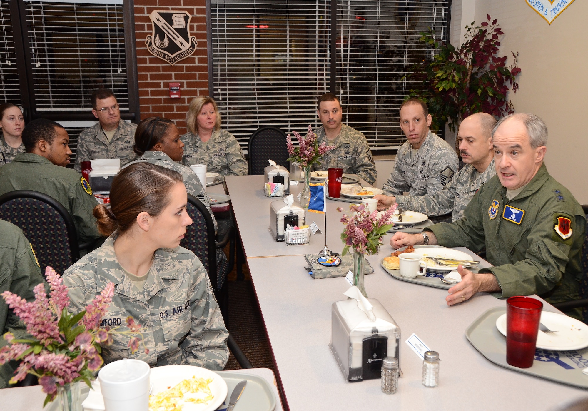 Maj. Gen. James Poss, right, assistant deputy chief of staff for intelligence, surveillance and reconnaissance, Headquarters U.S. Air Force, speaks to enlisted intelligence personnel from the 461st and 116th Air Control Wings during a breakfast at the Wynn Dining Facility, Robins Air Force Base, Ga., Jan. 26, 2012.  Poss met with intelligence personnel at Robins during a two-day  intelligence organizations site visit. (National Guard photo by Master Sgt. Roger Parsons/Released)