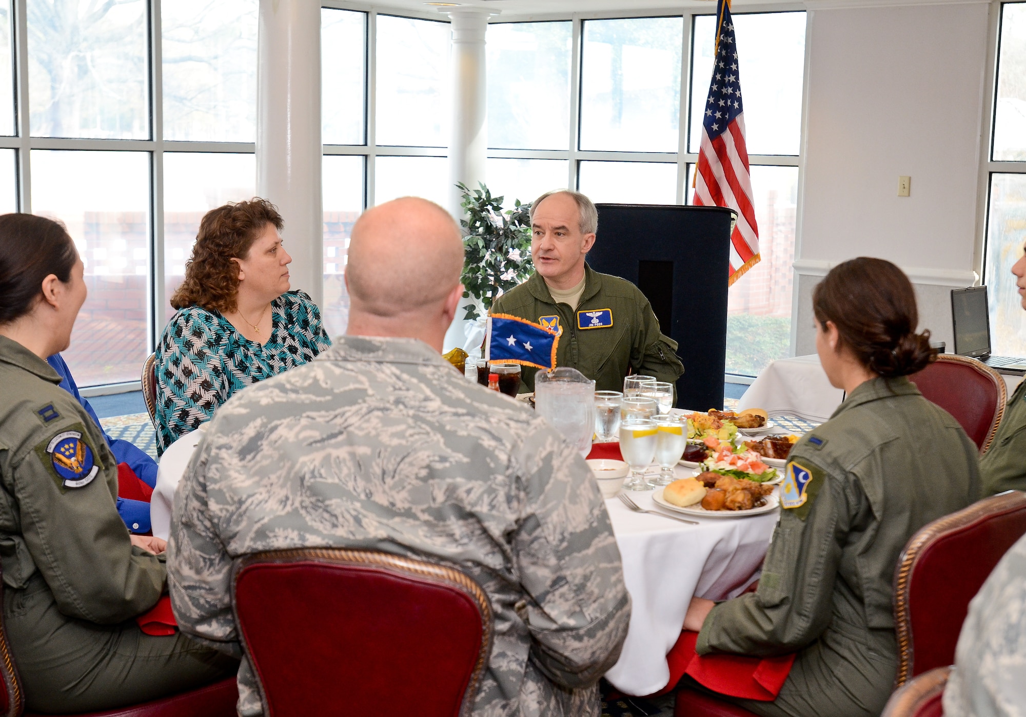 Maj. Gen. James Poss, center, assistant deputy chief of staff for intelligence, surveillance and reconnaissance, Headquarters U.S. Air Force, speaks to intelligence officers and civilians during a lunch at the Horizon's Club, Robins Air Force Base, Ga., Jan. 26, 2012.  Poss met with intelligence personnel at Robins during a two-day  intelligence organizations site visit.   (National Guard photo by Master Sgt. Roger Parsons/Released)