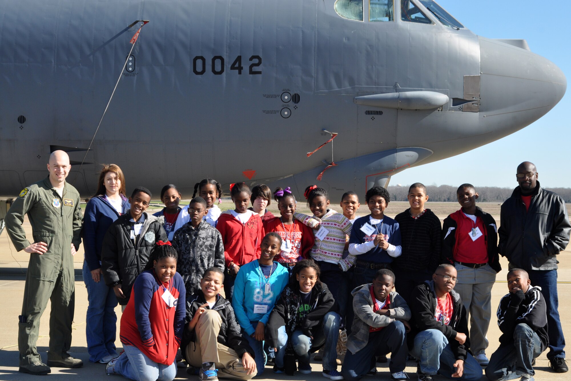 U.S. Air Force 1st Lt. Nicholas Jacks, a student pilot at the 93rd Bomb Squadron’s Formal Training Unit, poses with a group of local 5th grade students after explaining the war-time capabilities of the B-52 Startofortress during a static tour at Barksdale Air Force Base, La., Jan. 27, 2012. Jacks is assigned to the 11th Bomb Squadron, 2nd Bomb Wing at Barksdale. The students are attending STARBASE Louisiana, at Barksdale, one of 70 national STARBASE sites. It is sponsored by the 307th Bomb Wing of the Air Force Reserve Command. The program presents an exciting 25-hour hands-on minds-on Science, Technology, Engineering, and Mathematics (STEM) curriculum to area 5th grade students and their teachers. STARBASE Louisiana creates an environment to actively engage students in STEM exploration to excite their interest, develop a solid concept base, and encourage them to pursue these areas in future studies. Approximately 90 students from Summer Grove Elementary and Central Elementary in Caddo Parish and Waller Elementary in Bossier Parish took part in the static tour. (U.S. Air Force photo by Betty Stephens)
