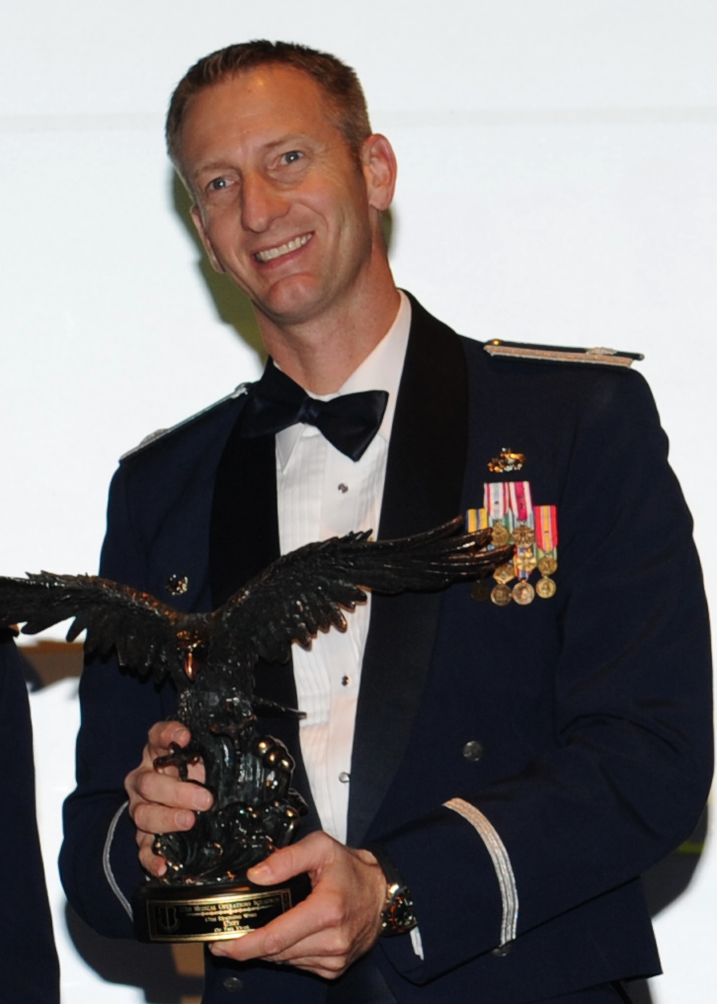 GOODFELLOW AIR FORCE BASE, Texas -- Lt. Col. Keith Logeman, 17th Training Support Squadron Commander, accepts the 17th Training Wing 2011 Sports Day trophy for the small squadron on behalf of the 17th TRSS. The annual awards program recognizes military and civilian personnel who compete in 25 categories for their significant contributions to the 17th TRW, the community and the mission. (U.S. Air Force photo/ Staff Sgt. Laura R. McFarlane) 