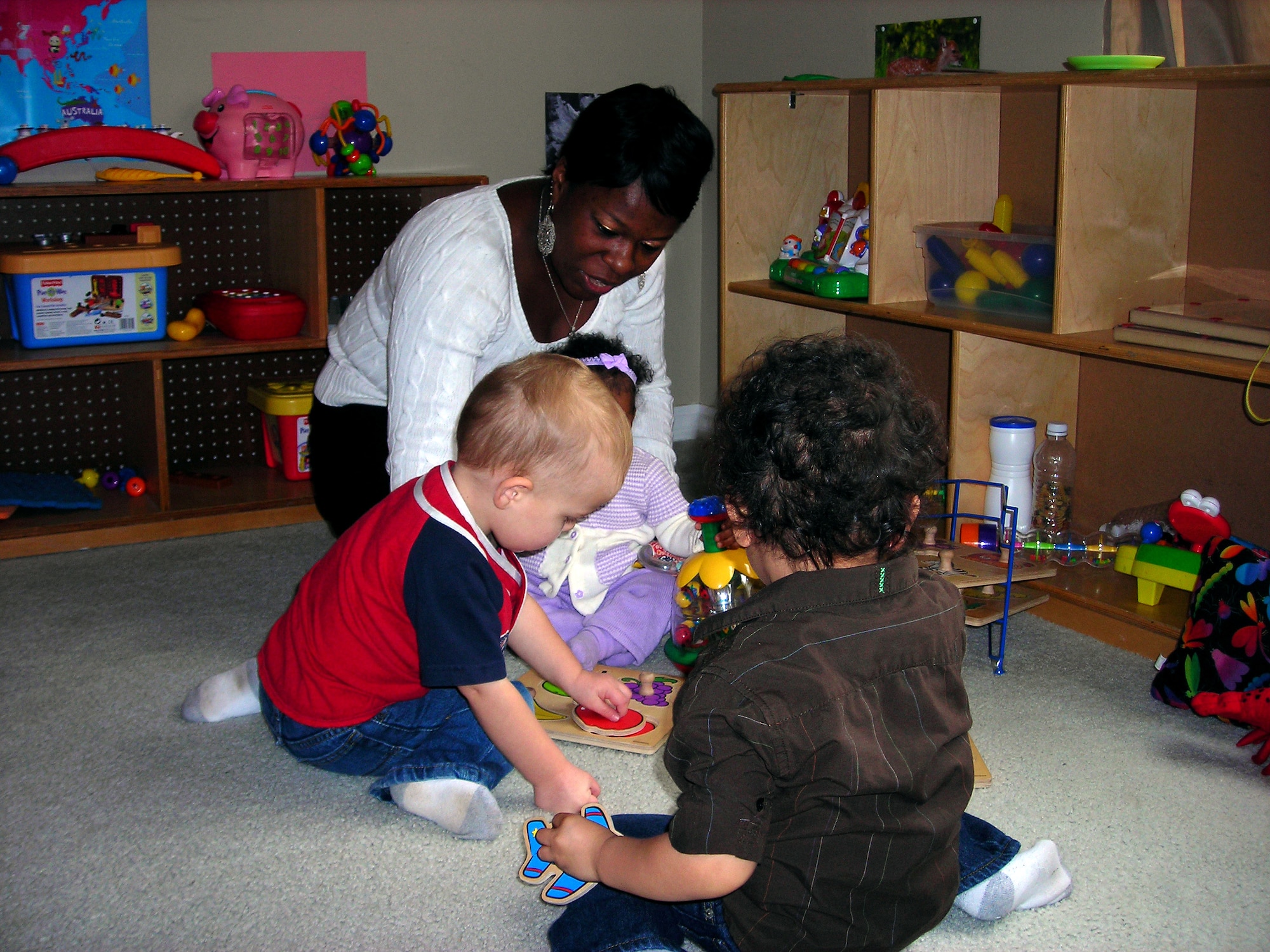 Latanga Cunningham, a Family Child Care provider, interacts with children in her home day care. Cunningham is one of 19 FCC providers licensed through Hurlburt Field. (Courtesy photo) 