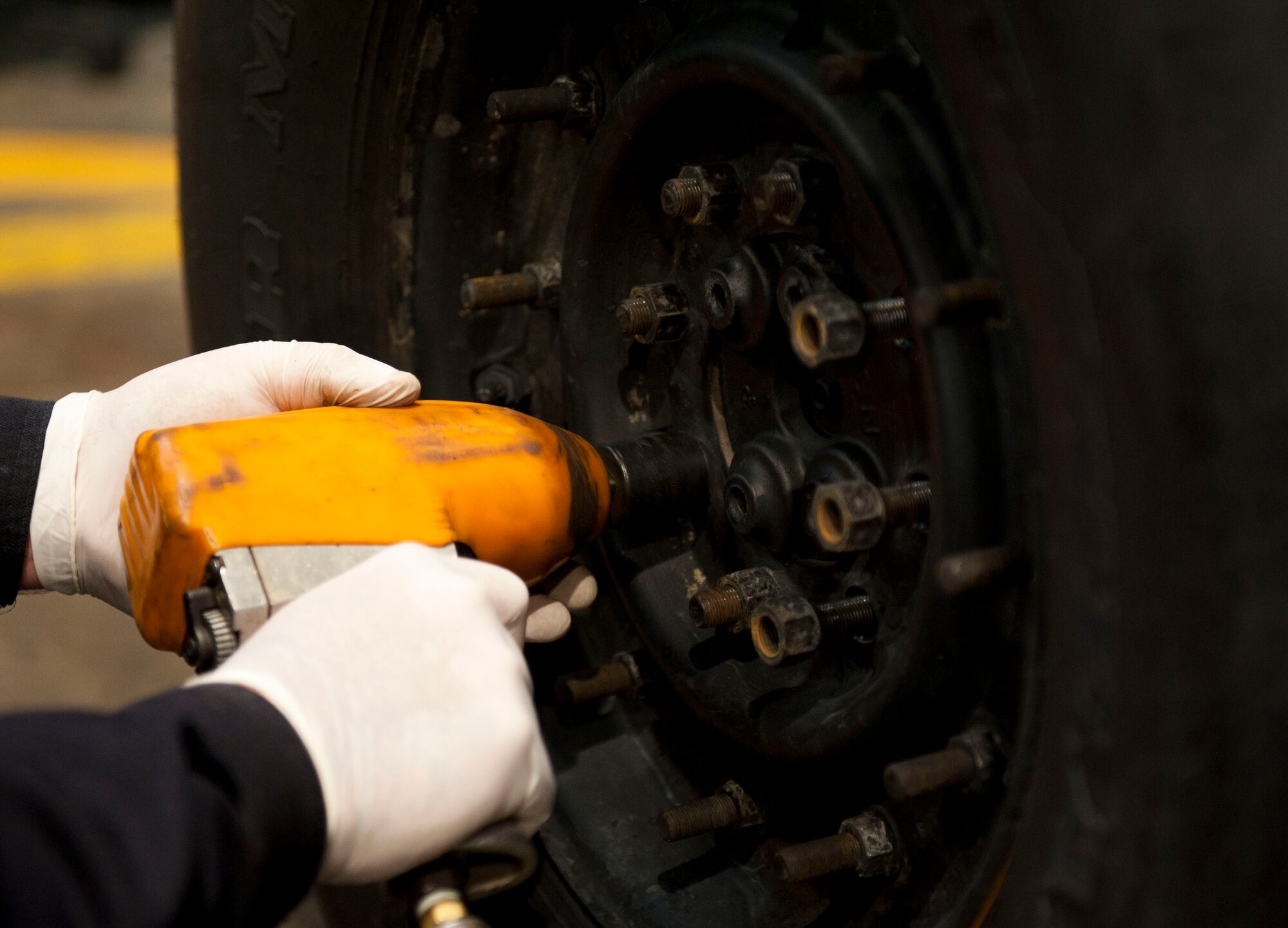 Aykut Kuralay, 39th Logistics Readiness Squadron, tightens bolts to a wheel Jan. 26, 2012, at Incirlik Air Base, Turkey. Vehicle maintenance performs maintenance on all U.S. government motor vehicles and equipment assigned to Incirlik. They perform scheduled inspections and services, preventive maintenance and any repairs required to maintain the vehicle or equipment in a safe and serviceable condition. (U.S. Air Force photo by Senior Airman Clayton Lenhardt/Released)