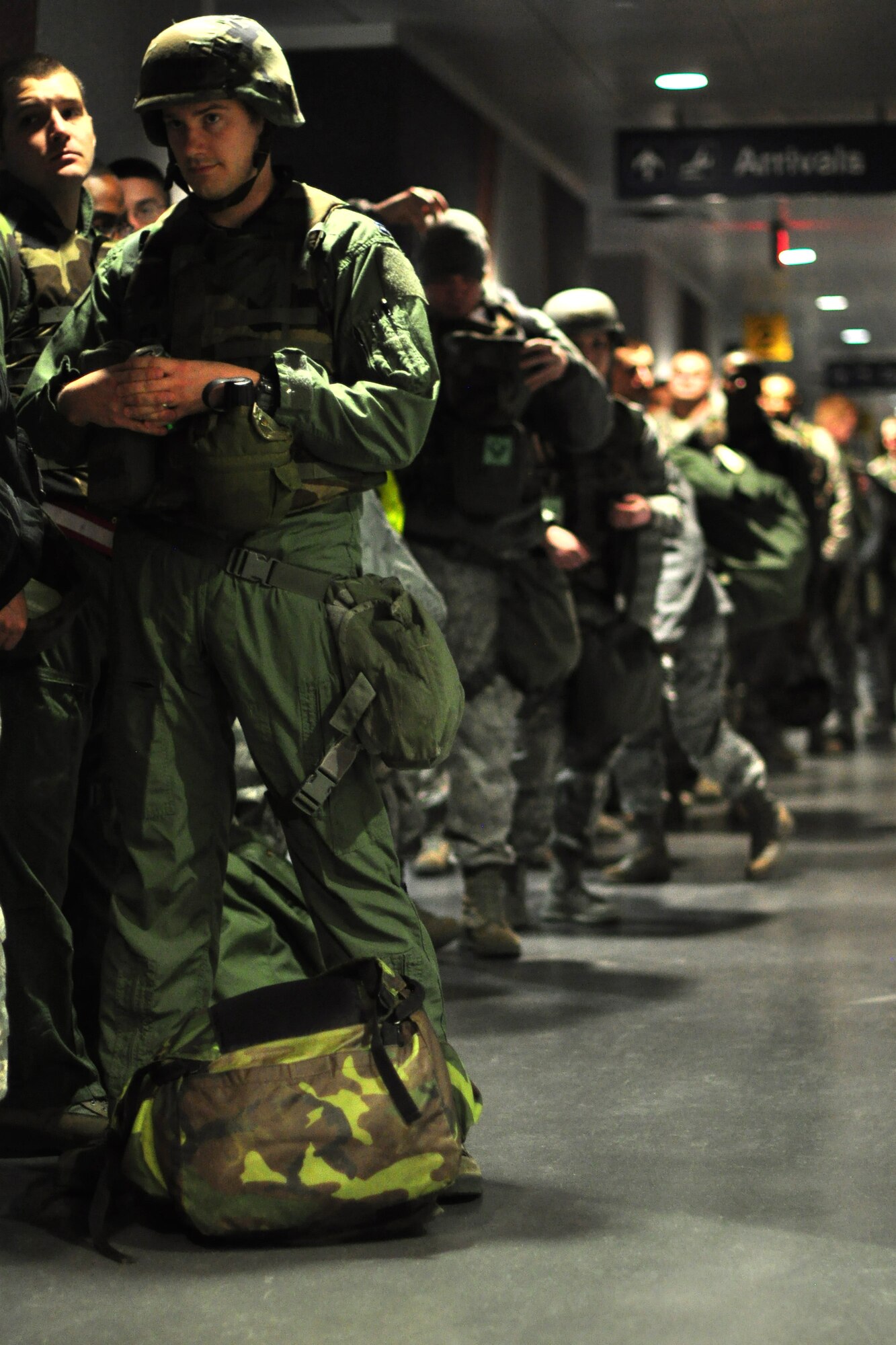 Different agency representatives from the 51st Fighter Wing process 25 individuals thorough a follow-on forces deployment line during Beverly Bulldog 12-01 at Osan Air Base Republic of Korea Jan. 30, 2012. Operational readiness exercises such as this are used to ensure members are ready and prepared to react to a wartime contingency and help defend South Korea.  (U.S. Air Force photo/Tech. Sgt. Chad Thompson)