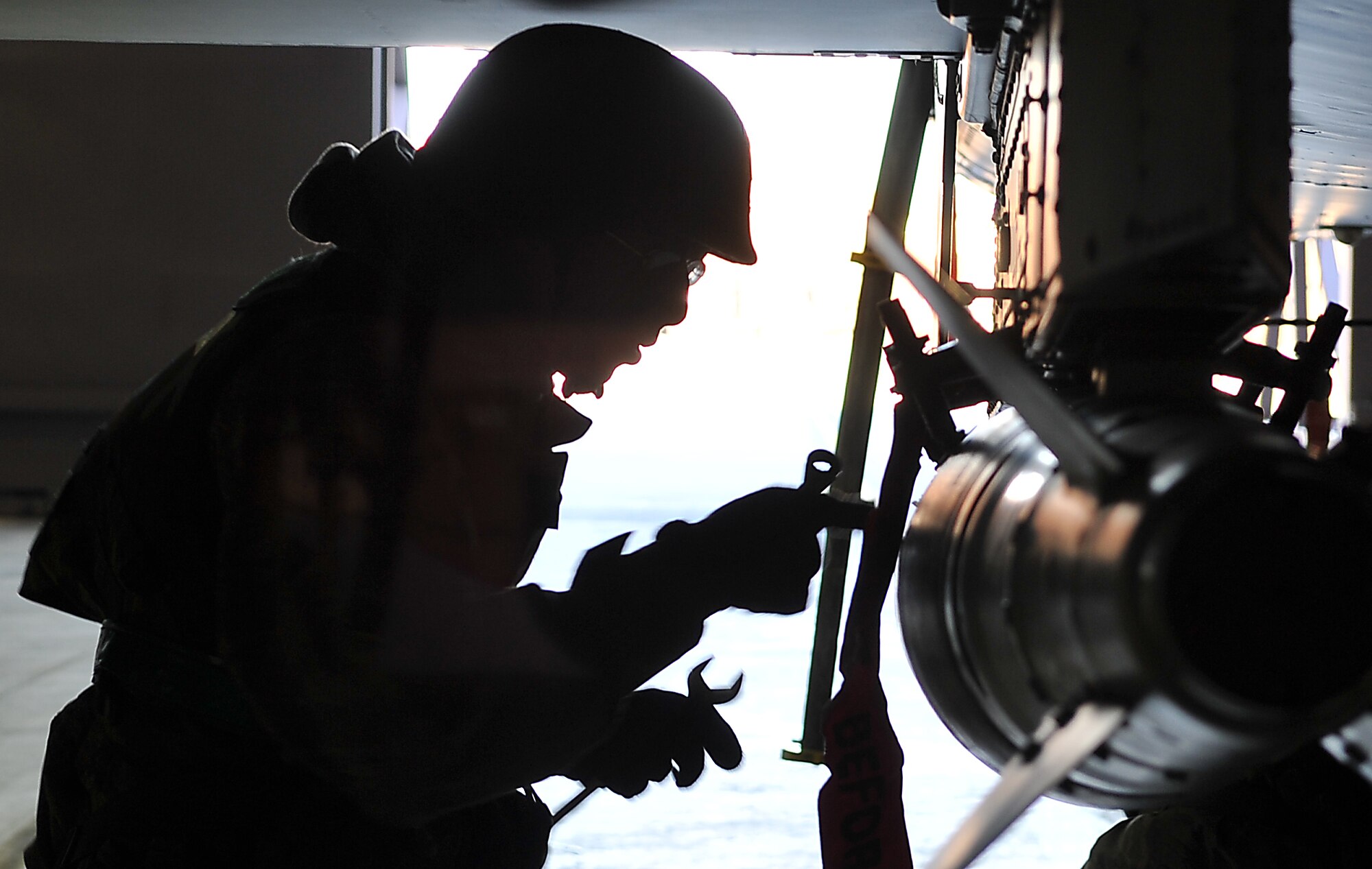 Airman 1st Class Hector Rodriguez, 25th Aircraft Maintenance Unit weapons load crew member attaches a GBU-38 to an A-10 Thunderbolt II during an exercise at Osan Air Base, Republic of Korea Jan. 30. Beverly Bulldog 12-01 is the first week-long simulated wartime contingency exercise designed to test the base’s response during a wartime contingency. (U.S. Air Force photo/Staff Sgt. Stefanie Torres)