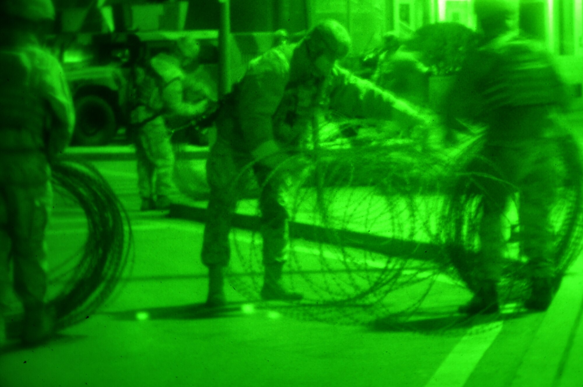 Members of 51st Security Forces Squadron, setup concertina wire around the base Jan. 30, 2012. The Airmen are participating in a peninsula-wide operational readiness exercise, Beverly Bulldog 12-01, held to train U.S. forces throughout South Korea. (U.S. Air Force photo/Staff Sgt. Craig R. Cisek)
