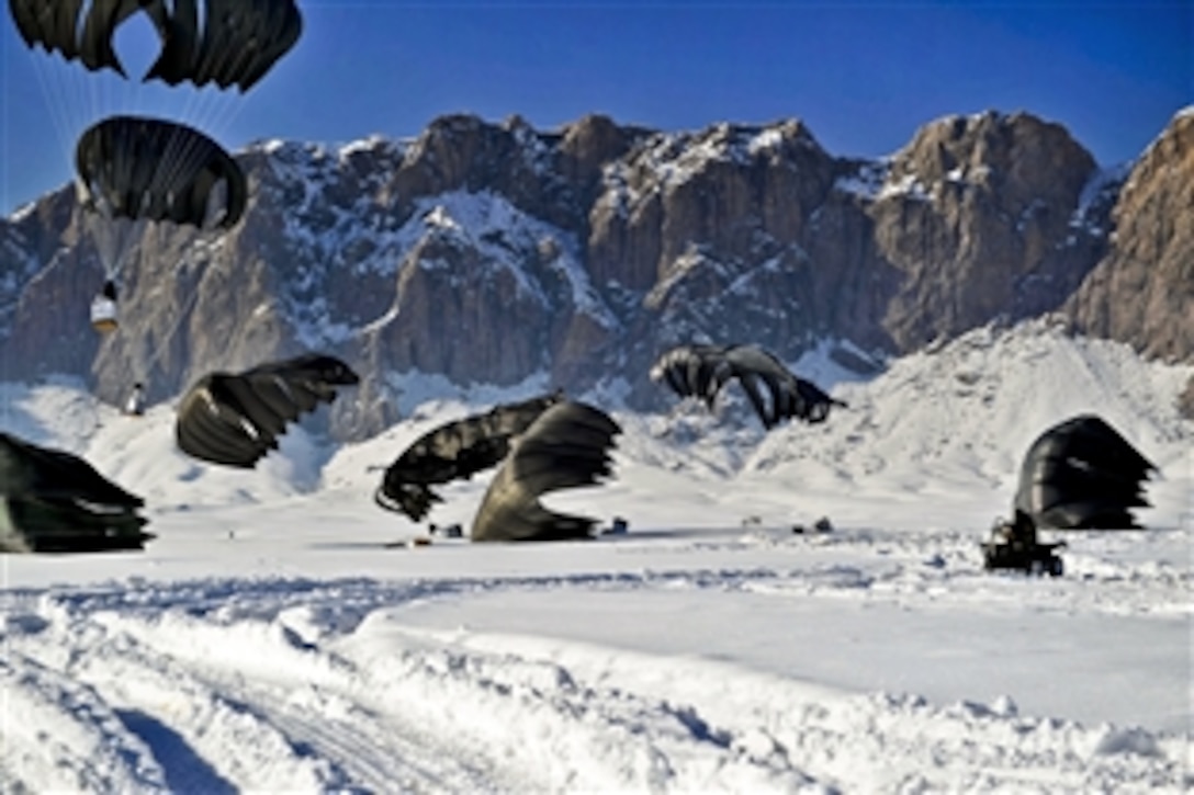 A member of the coalition special operations forces begins to recover pallets of supplies in the snow during an airdrop in the Shah Joy district in Afghanistan's Zabul province, Jan. 25, 2012. The coalition is part of the International Security Assistance Force.
