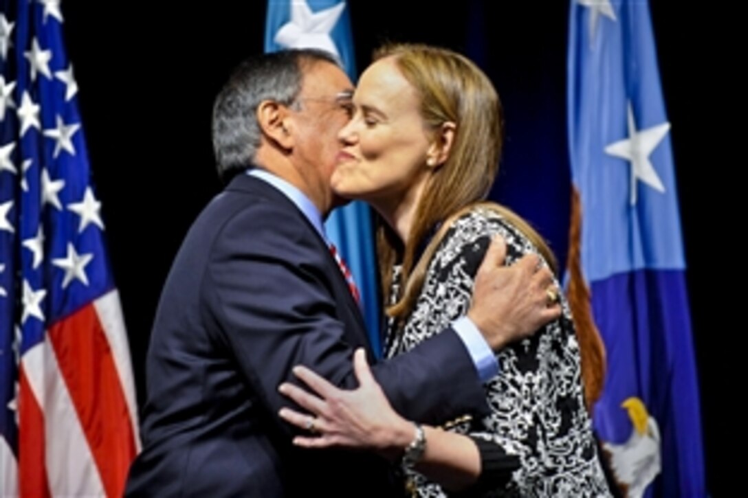 Defense Secretary Leon E. Panetta gives Michele Flournoy, undersecretary of defense for policy, a farewell kiss during a ceremony in her honor at the Pentagon, Jan. 30, 2012.