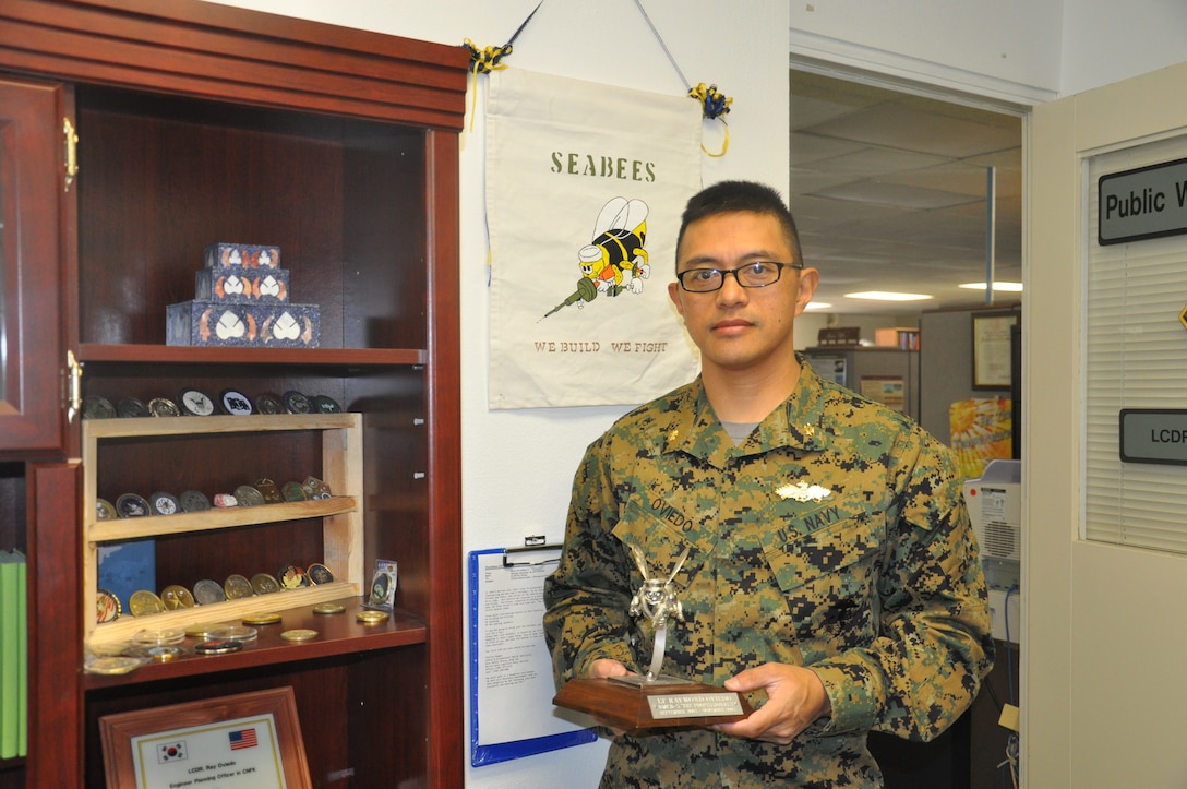 Lieutenant Cmdr. Raymond H. Oviedo, the new Resident Officer in Charge of Construction aboard Marine Corps Logistics Base Barstow Jan. 30, proudly displays his official “Seabee” award presented to him by his colleagues when he was stationed with Naval Mobile Construction Battalion 5, headquartered in Port Hueneme, Calif., from 2003 to 2005.