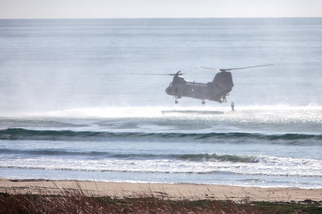 A reconnaissance Marine with Alpha Company, 1st Reconnaissance Battalion jumps into the Pacific Ocean at the Red Beach training area during helo casting training, Jan. 30.  The event was a part of Exercise Iron Fist 2012, a bilateral training event with the Japanese, designed to increase interoperability between the two services. The purpose of helo casting is to insert troops over the horizon and have them come ashore to conduct reconnaissance missions. (U.S. Marine Corps photo by Lance Cpl. Timothy Childers)