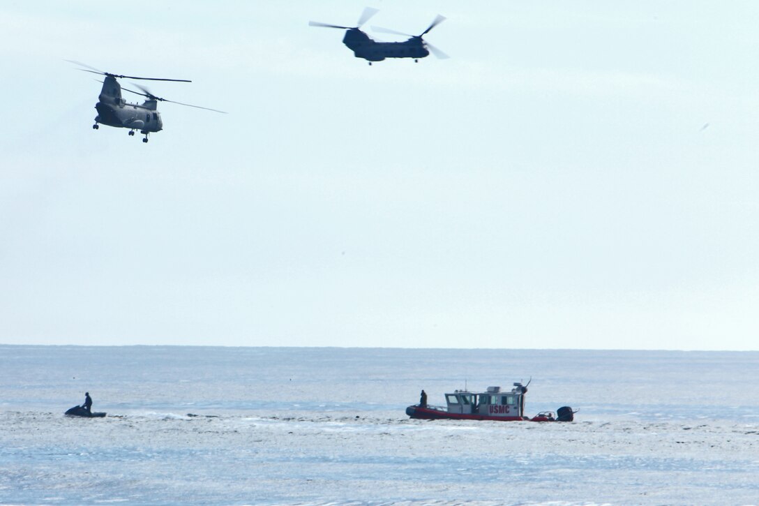 ::r::::n::CH-46E Sea Knight helicopters prepare to tactically insert troops into the Pacific Ocean at the Red Beach training area during helo casting training, Jan. 30. The event was a part of Exercise Iron Fist 2012, a bilateral training event with the Japanese, designed to increase interoperability between the two services. The purpose of helo casting is to insert troops over the horizon and have them come ashore to conduct reconnaissance missions. (U.S. Marine Corps photo by Lance Cpl. Timothy Childers)