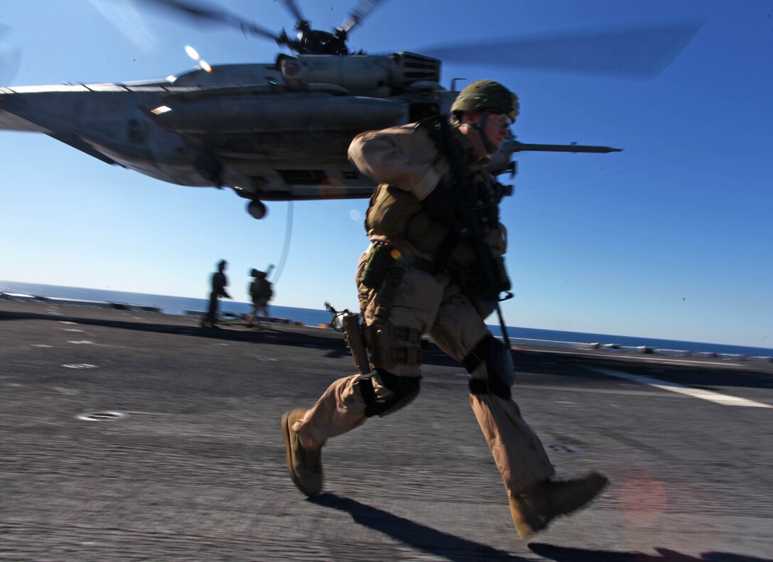 Marines and Sailors with the Security Element Platoon, Headquarters and Service Company, Battalion Landing Team 1st Battalion, 2nd Marine Regiment, 24th Marine Expeditionary Unit, fast rope onto the USS Iwo Jima from a CH-53E Super Stallion helicopter in preparation for an upcoming  simulated Expanded Visit, Board, Search and Seizure, Jan. 30, 2012.  The 24th MEU is conducting their Certification Exercise (CERTEX) with Iwo Jima Amphibious Ready Group scheduled Jan. 27 to Feb. 17, which includes a series of missions intended to evaluate and certify the unit for their upcoming deployment. The CH-53E helicopters are a detachment from HMH-464 based at Marine Corps Air Station New River, N.C., and comprise part of Marine Medium Tiltrotor Squadron VMM-261 (Rein), which is the Aviation Combat Element for the 24th MEU.