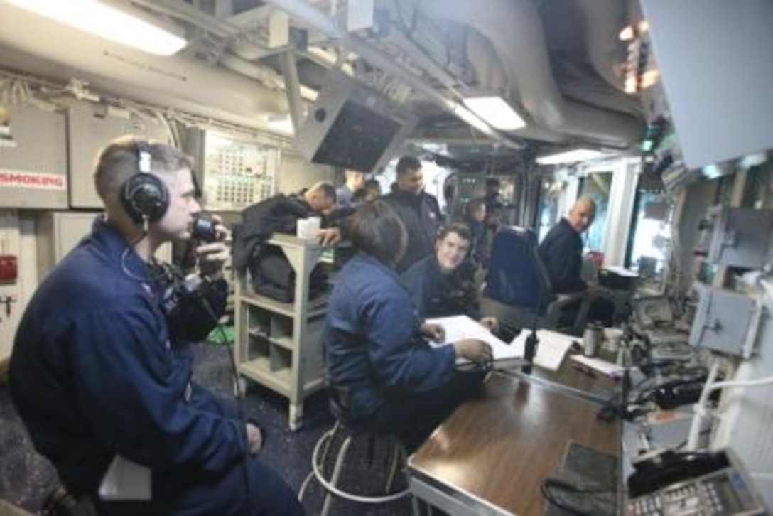 Sailors aboard the USS Kearsarge man the well deck’s operating center during Exercise Bold Alligator 2012 as landing craft, air cushions board the ship Jan. 31. The logistics personnel for both the Navy and Marine Corps personnel are expected to gain experience in smoothly bringing gear aboard ship and taking gear off ship. This exercise is scheduled to run through Feb. 12 afloat and ashore in and around Virginia and North Carolina.