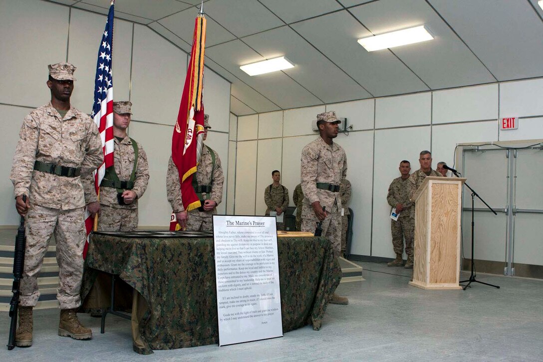 Maj. Gen. Glenn M. Walters (right),2nd Marine Aircraft Wing (Forward) commanding general, speaks during a dedication of the Flightline Memorial Chapel at Camp Bastion, Afghanistan, Jan. 31. The ceremony was in remembrance of the U.S. Marine lives lost while supporting Marine Corps aviation in Afghanistan.