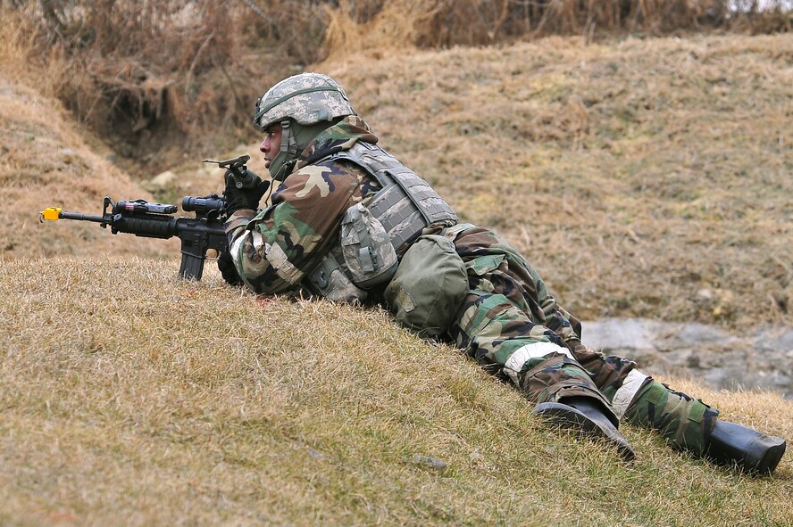 Senior Airman Floyd Dewiit, 51st Security Forces Squadron patrolman, responds to a simulated intrusion of Osan Air Base Jan. 31, 2012. Team Osan is participating in a peninsula-wide operational readiness exercise, Beverly Bulldog 12-01, held to train U.S. forces throughout South Korea. (U.S. Air Force photo/Staff Sgt. Stefanie Torres)