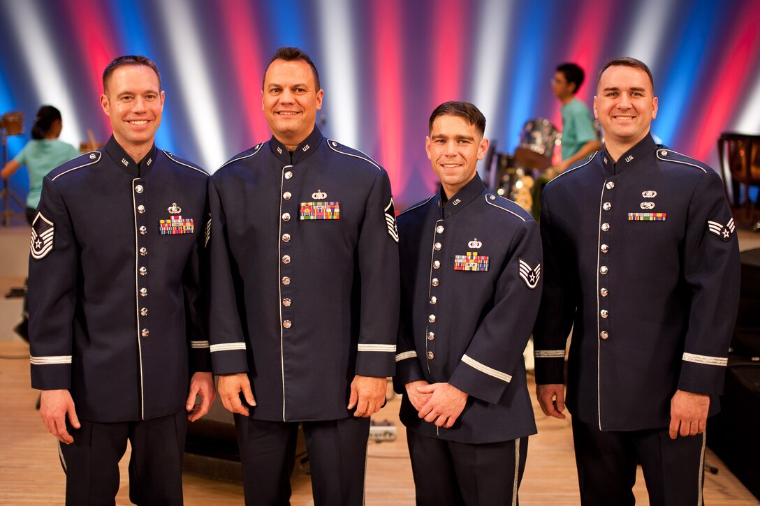 HAMURA CITY, Japan -- Final Approach, Band of the Pacific-Asia jazz group, poses for a photograph after the Japan-U.S. Joint Concert at the Yutorogi Learning Center, Hamura City, Japan, Jan. 28, 2012. Final Approach received many requests for pictures after the show. (U.S. Air Force photo/Staff Sgt. Josh Voyles)