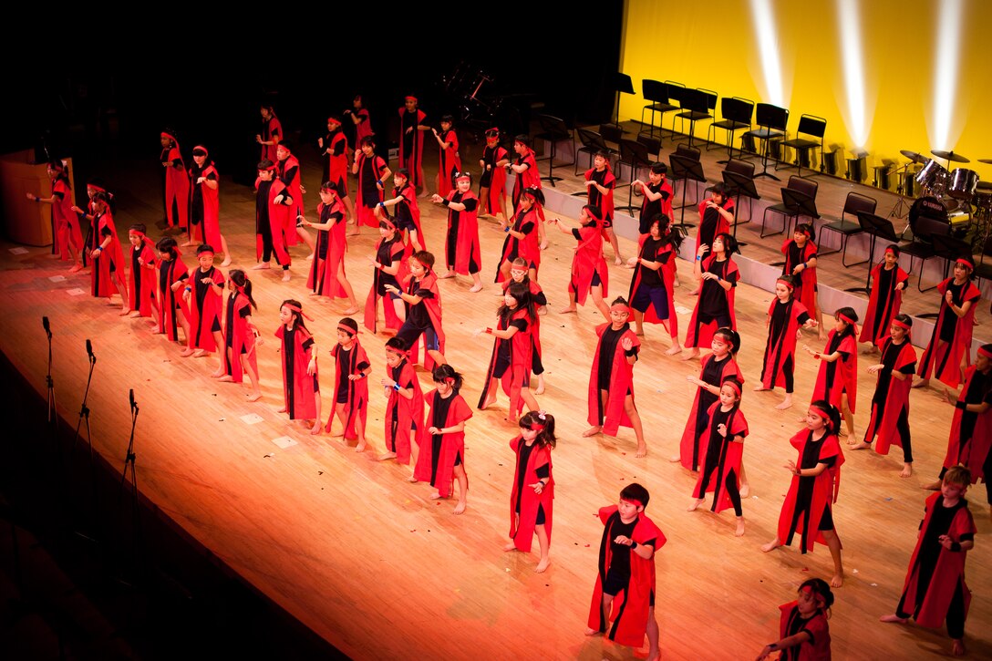 HAMURA CITY, Japan -- OZK24 and Yokota West Elementary School students open the concert with a dance routine during the Japan-U.S. Joint Concert at the Yutorogi Learning Center, Hamura City, Japan, Jan. 28, 2012. The choreography is highley engergetic, combining traditional Japanese dance movements with modern music. (U.S. Air Force photo/Staff Sgt. Josh Voyles)
