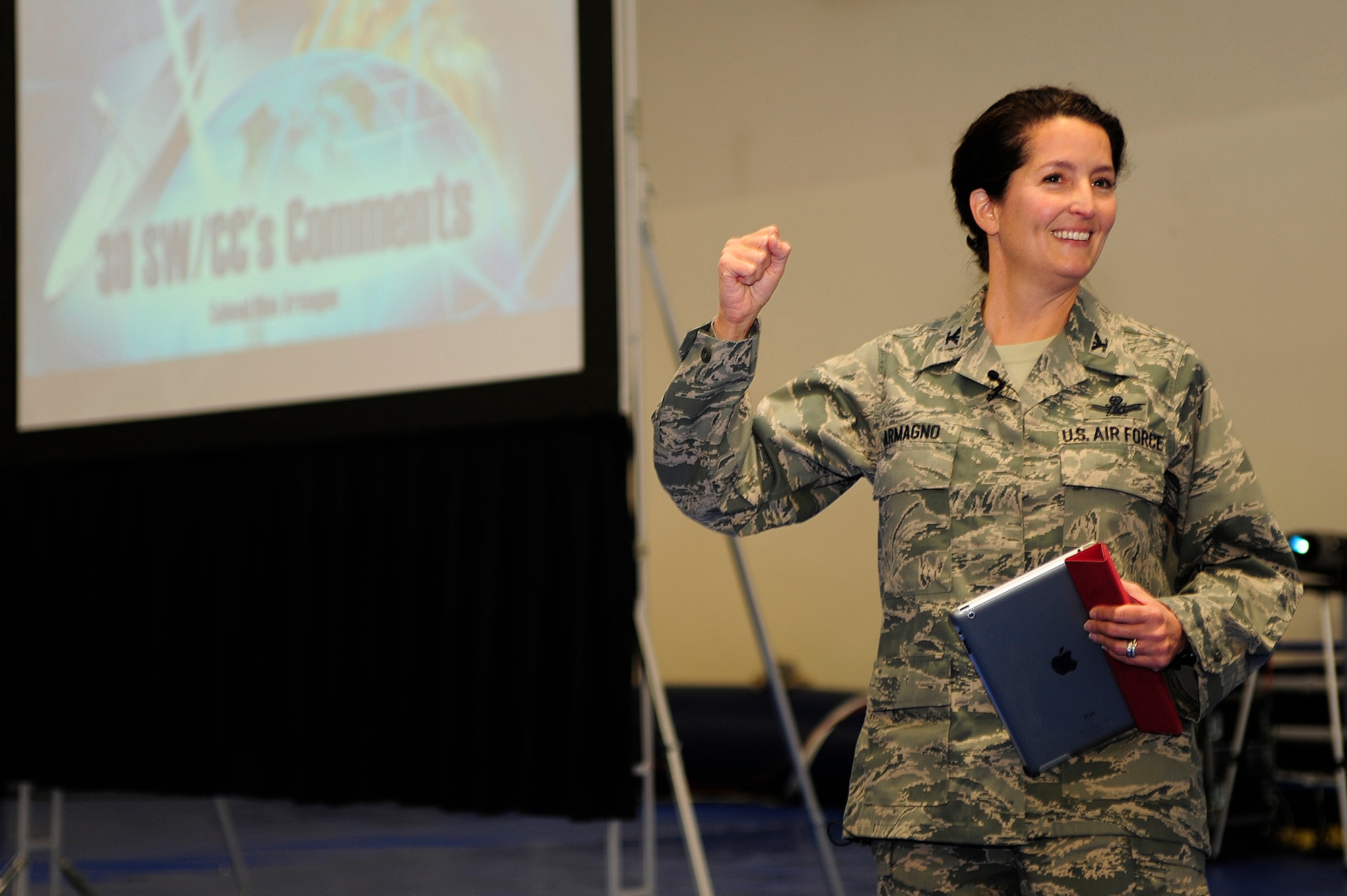 VANDENBERG AIR FORCE BASE, Calif. -- Col. Nina Armagno, 30th Space Wing commander, cheers the wing on during her first commander's call at the base gym Friday, Jan. 27, 2012. Armagno spoke to the wing about safety, base security and ensuring a reliable launch environment at Vandenberg. (U.S. Air Force photo/Staff Sgt. Andrew Satran) 

 