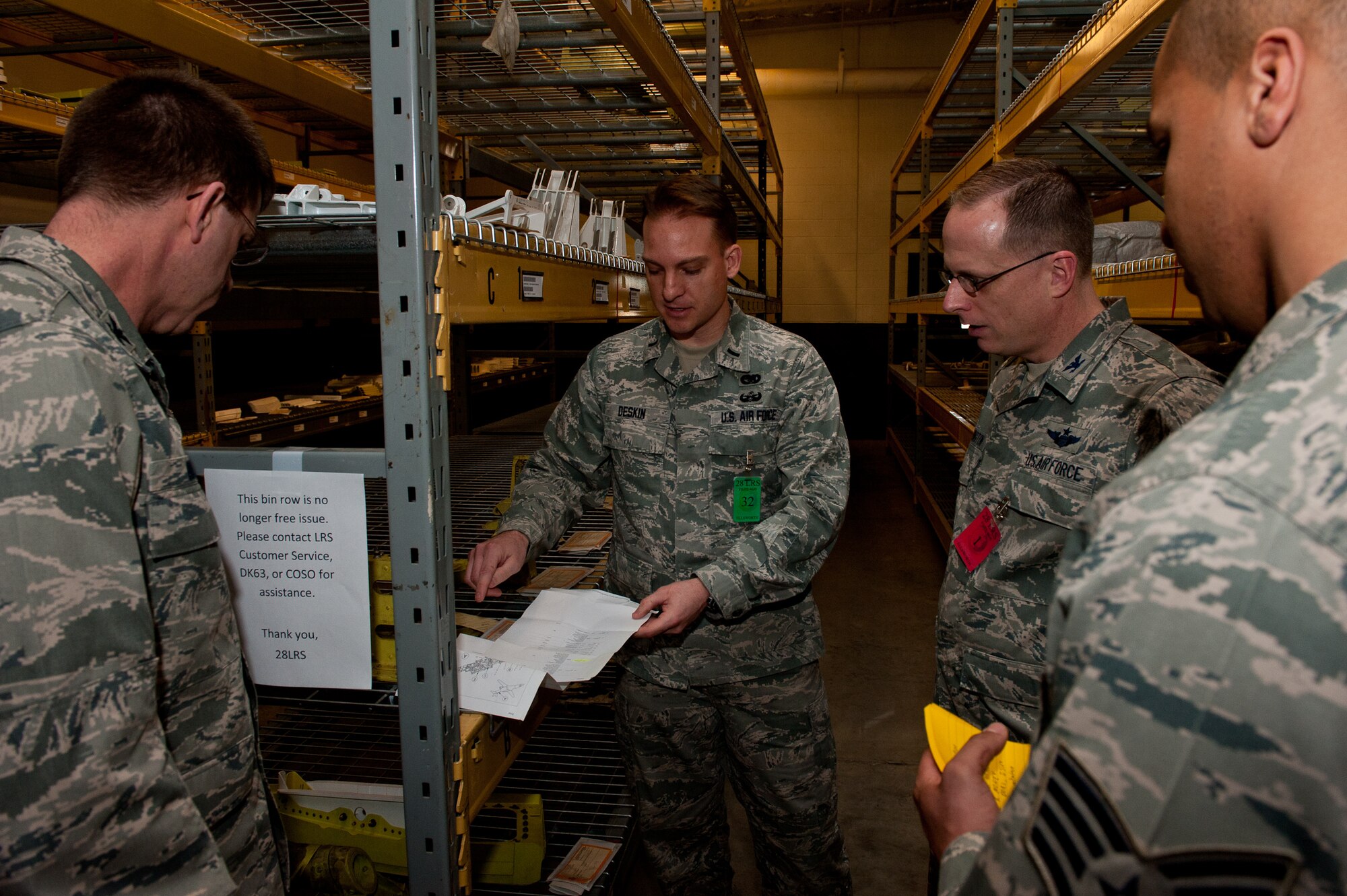 Airmen of the 28th Logistics Readiness Squadron explain to Ellsworth commanders the purpose of Al’s Garage at Ellsworth Air Force Base, S.D., Jan. 26, 2012. Al’s Garage is a storage warehouse of B-1B parts that were left behind during a transition to another facility years ago. Recently rediscovered parts were organized, labeled and placed back into inventory to prevent wasting resources on excess aircraft parts. (U.S. Air Force photo by Airman 1st Class Kate Thornton/Released)