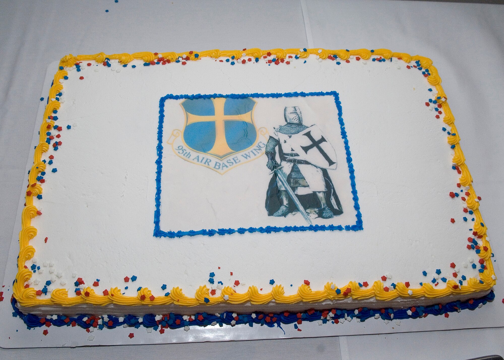 Justin Knight and the 95th Air Base Wing shield decorate the cake that helped celebrate the evening at the 95th Air Base Wing Annual Awards Ceremony Jan. 27 at the Conference Center. (U.S. Air Force photo by Rob Densmore)
