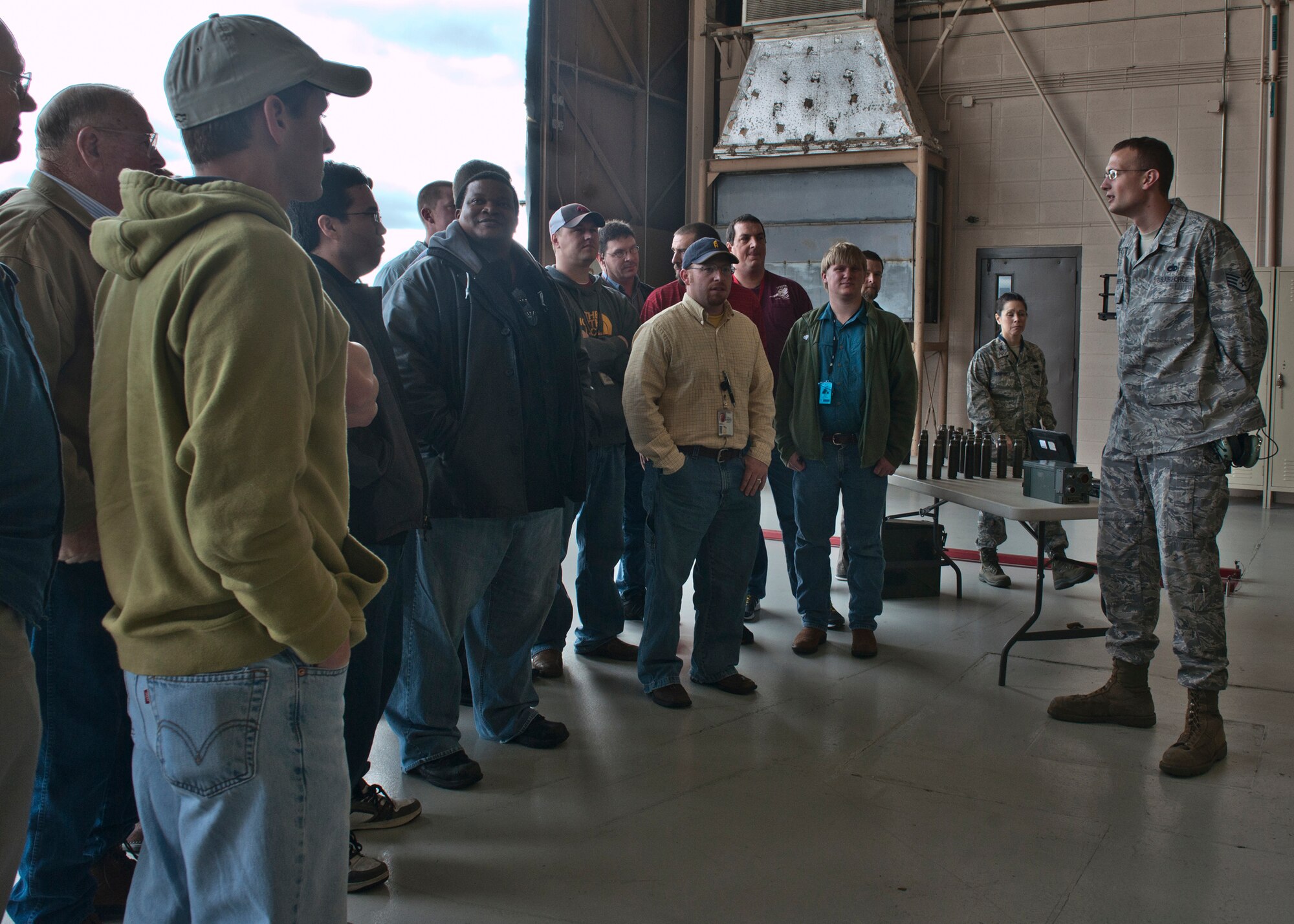 U.S. Air Force Staff Sgt. Nick Chamberlain, 23d Aircraft Maintenance Squadron, briefs the 402d Electronics Maintenance Group on the A-10C Thunderbolt II weapons capabilities at Moody Air Force Base, Ga., Jan. 27, 2012. The 402d EMXG is from Robins Air Force Base and this is their first time visiting here. The group came to see firsthand the work they do that helps accomplish the mission. (U.S. Air Force photo by Senior Airman Eileen Meier/Released) 