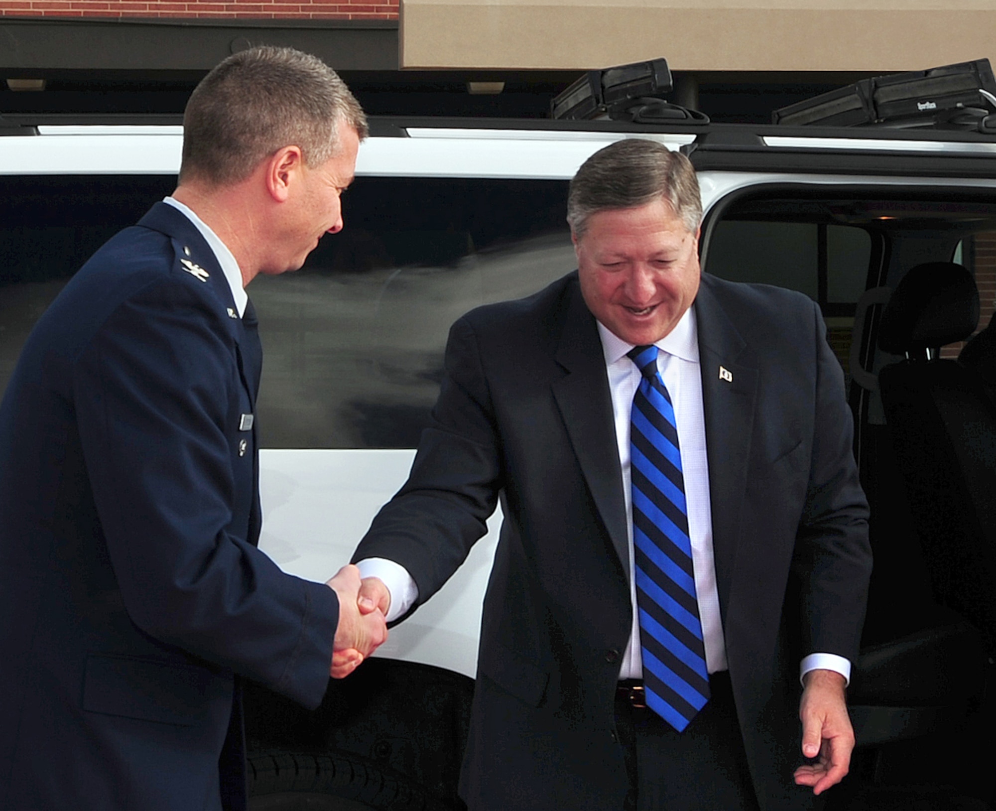 PETERSON AIR FORCE BASE, Colo. - Secretary of the Air Force Michael Donley is greeted by Col. Jeffrey Flewelling, 21st Space Wing vice commander, Jan. 27, 2012, at Peterson AFB. While in the Colorado Springs and Denver area Jan. 26-27, Donley welcomed President Barack Obama to Buckley Air Force Base, met with civic and military leaders, and visited the Space Foundation. (U.S. Air Force photo/Duncan Wood)