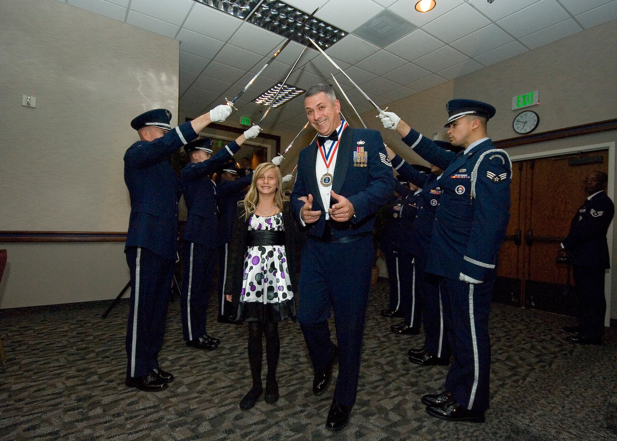 Tech. Sgt. Robert Novak, 95th Security Forces Squadron Physical Security NCO in charge, and his date, daughter Taylor, 12, make their entrance into the 95th Air Base Wing Annual Awards Ceremony Jan. 27 in the Conference Center. Novak won the award for the 95th Air Base Wing’s NCO of the year. (U.S. Air Force photo by Rob Densmore)