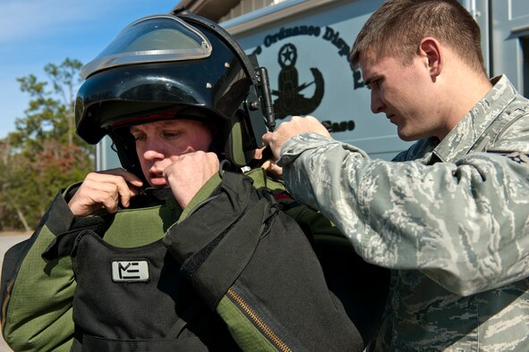 Staff Sgt. Travis Groeschel, an Explosive Ordnance Disposal technician with the 96th Civil Engineer Group, is outfitted in his bomb suit before performing at demonstration at Eglin Air Force Base, Fla.  The EOD flight is responsible for many of the range missions involving explosives.  They also respond to suspicious packages or recovered unexploded ordnance found in the area.  (U.S. Air Force photo/Samuel King Jr.)