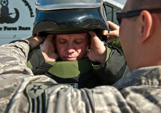 Staff Sgt. Travis Groeschel, an Explosive Ordnance Disposal technician with the 96th Civil Engineer Group, is outfitted in his bomb suit before performing at demonstration at Eglin Air Force Base, Fla.  The EOD flight is responsible for many of the range missions involving explosives.  They also respond to suspicious packages or recovered unexploded ordnance found in the area.  (U.S. Air Force photo/Samuel King Jr.)