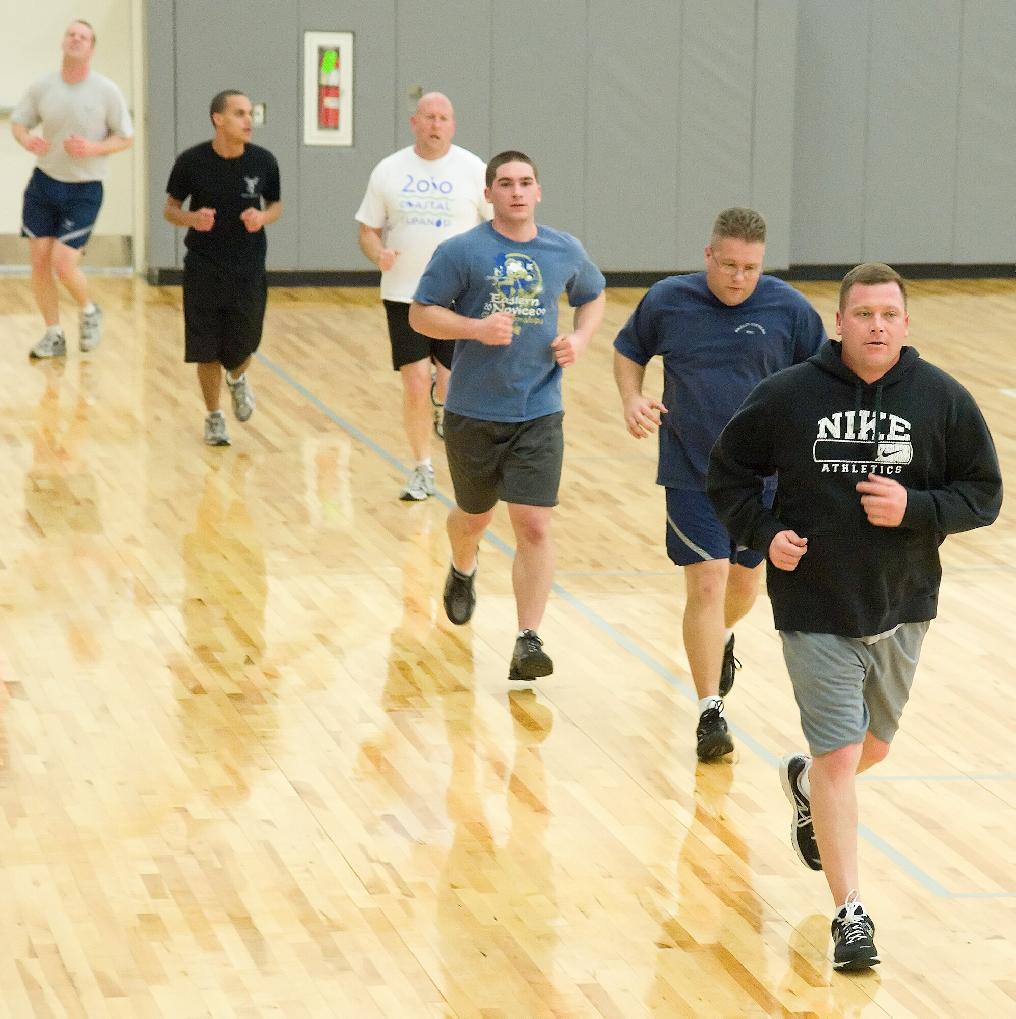 Members of Team Dover run during a 90-in-90 class Jan. 26, 2012, held at Dover Air Force Base, Del. This is one of the many classes held at the Health and Wellness Center geared towards physical fitness. (U.S. Air Force photo by Adrian Rowan)