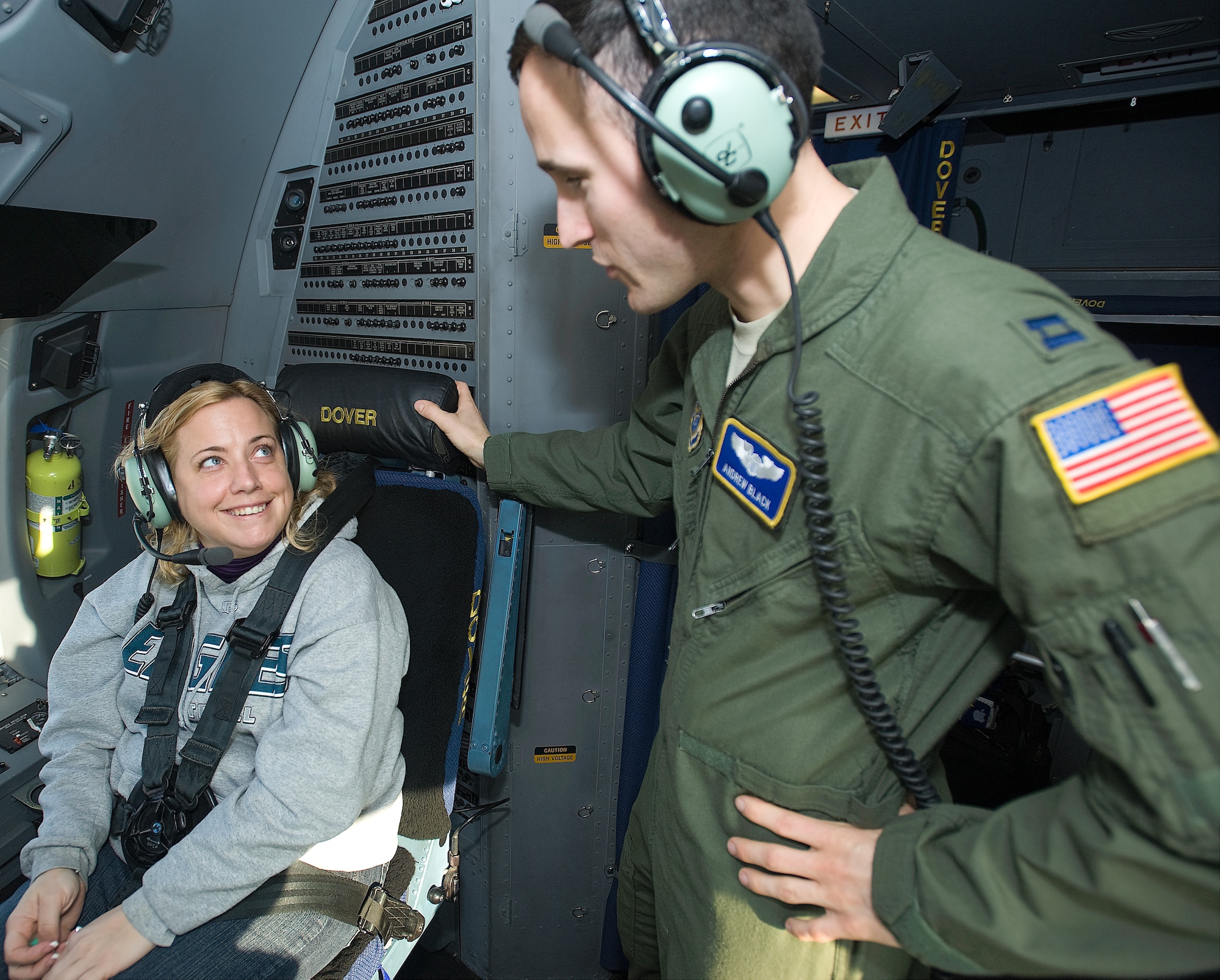 Kimberly Connel, a member of Leadership Central Delaware, speaks with Capt. Andrew Black, C-17 Globemaster III aircraft commander with the 3rd Airlift Squadron, in the cockpit of a C-17 Jan. 25, 2012. Local community members were afforded the opportunity to partner with Team Dover for the LCD’s annual orientation flight. (U.S. Air Force photo by Airman 1st Class Samuel Taylor)

