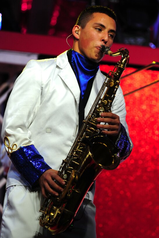 U.S. Air Force Airman 1st Class Gabriel Villaneuva, Tops In Blue tenor saxophone, performs for an audience at the Hampton Convention Center in Hampton, Va., Jan. 26, 2012.  Tops In Blue’s “Rhythm Nation” show features songs from the past and present that showcase the nation’s history.  (U.S. Air Force photo by Airman 1st Class Kayla Newman/Released)