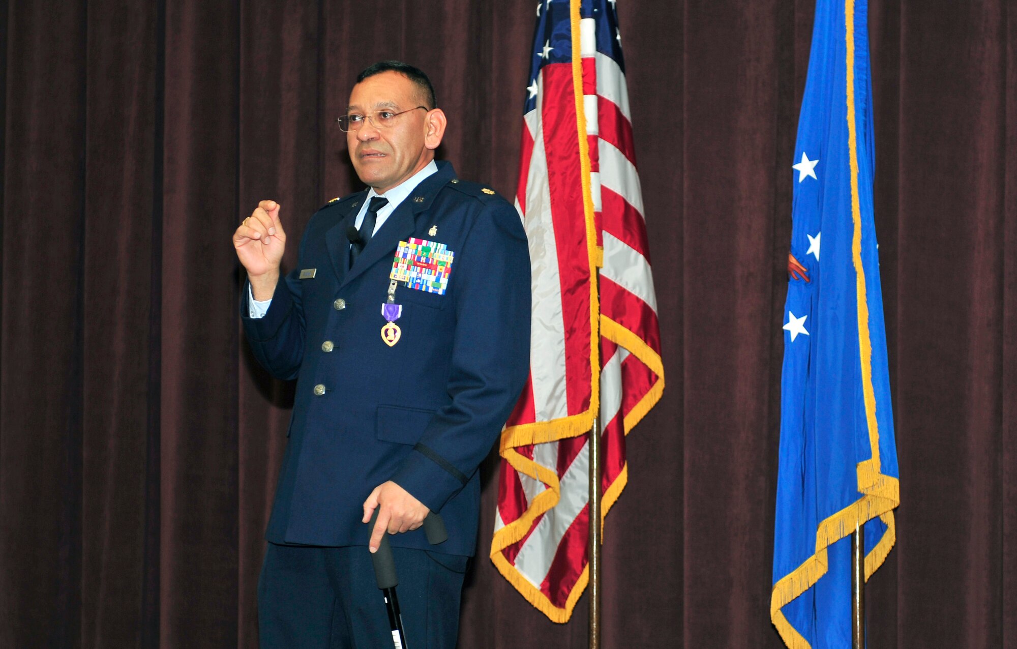 Maj. George Zaldivar speaks at his ceremony after receiving a Purple Heart from Gen. Raymond Johns, the Air Mobility Command commander, Jan. 9, 2012, at Scott Air Force Base, Ill. Zaldivar distinguished himself during a deployment to Kandahar, Afghanistan, in 2011 when he treated injured Airmen and prevented a fire after a rocket landed in their aeromedical evacuation building. (U.S. Air Force photo/Staff Sgt. Stephenie Wade)