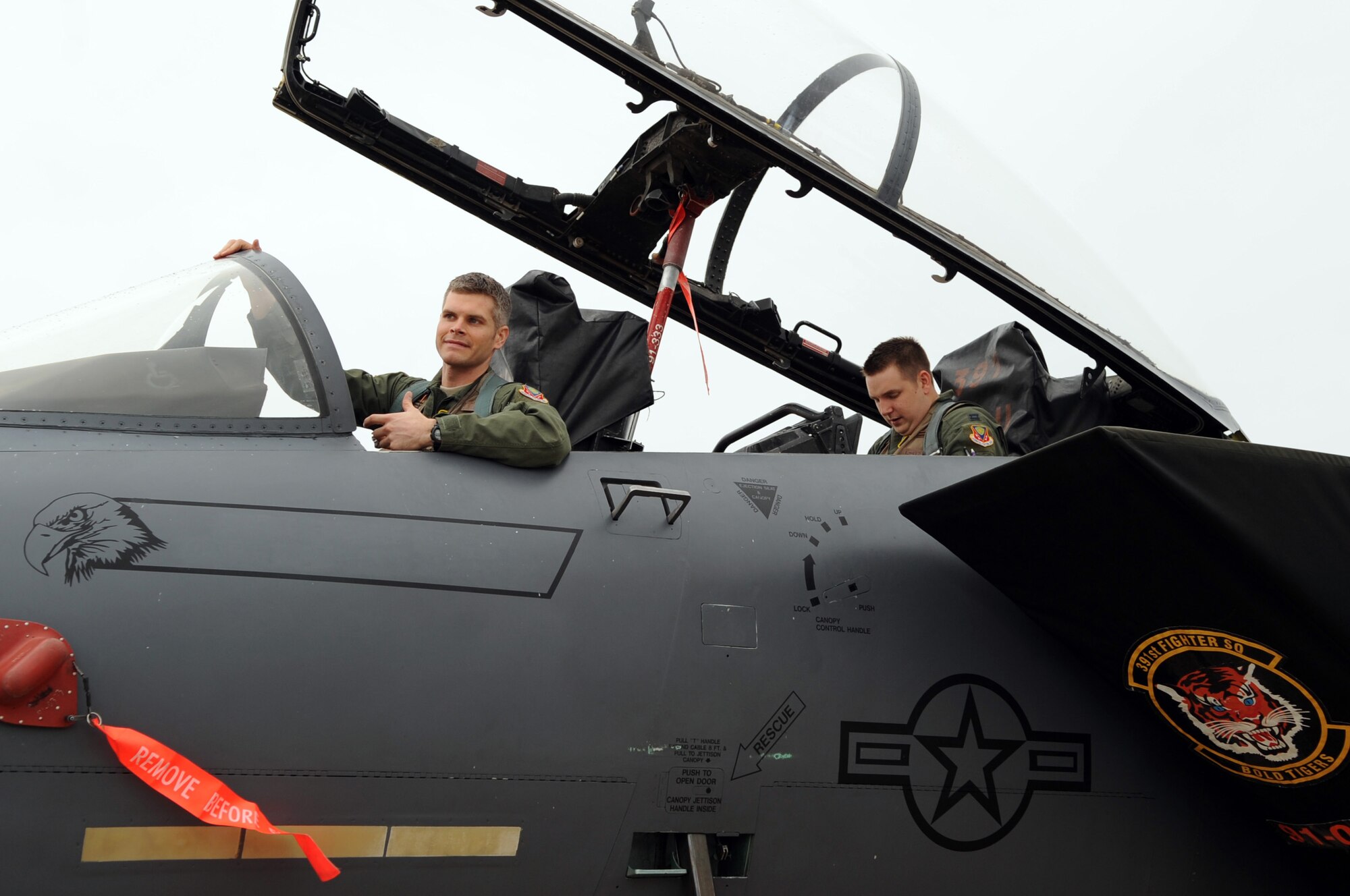 An F-15E Strike Eagle Pilot and a weapons systems officer assigned to the 391st Fighter Squadron from Mountain Home Air Force Base, Idaho, climbed into the cockpit of an F-15 on Barksdale Air Force Base, La., Jan. 25. The pilot and WSO explained pre-flight and takeoff procedures to the local media during an interview. (U.S. Air Force photo/Airman 1st Class Andrew Moua)(RELEASED)