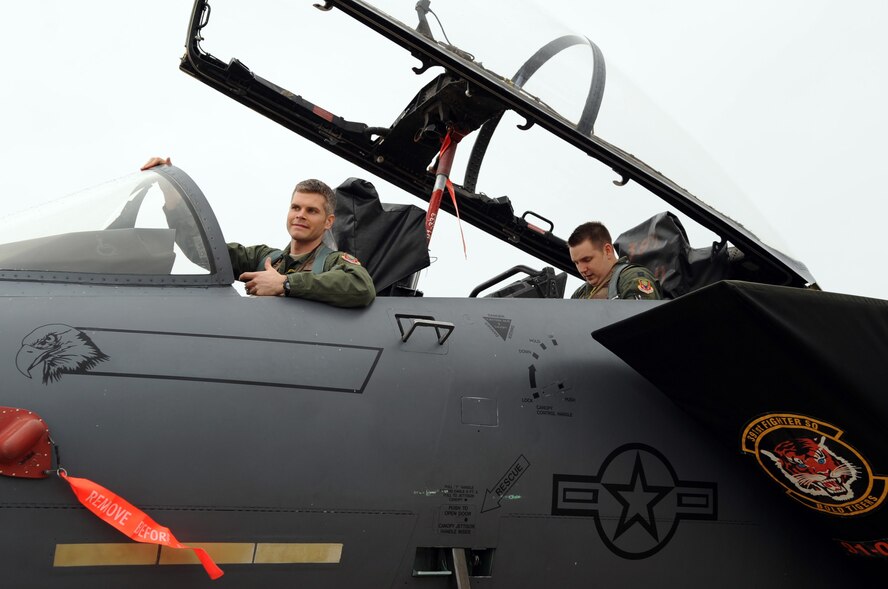 An F-15E Strike Eagle Pilot and a weapons systems officer assigned to the 391st Fighter Squadron from Mountain Home Air Force Base, Idaho, climbed into the cockpit of an F-15 on Barksdale Air Force Base, La., Jan. 25. The pilot and WSO explained pre-flight and takeoff procedures to the local media during an interview. (U.S. Air Force photo/Airman 1st Class Andrew Moua)(RELEASED)
