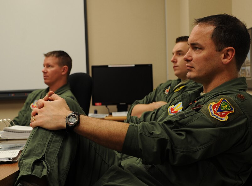 A group of pilots, assigned to the 391st Fighter Squadron, Mountain Home Air Force Base, Idaho, listen to a mission briefing on Barksdale Air Force Base, La., Jan. 25. More than 200 personnel traveled here to participate in Green Flag East. During the two-week exercise, the aircrew practiced with soldiers from the Army in combat scenarios to prepare for future deployments. (U.S. Air Force photo/Airman 1st Class Andrew Moua)(RELEASED)