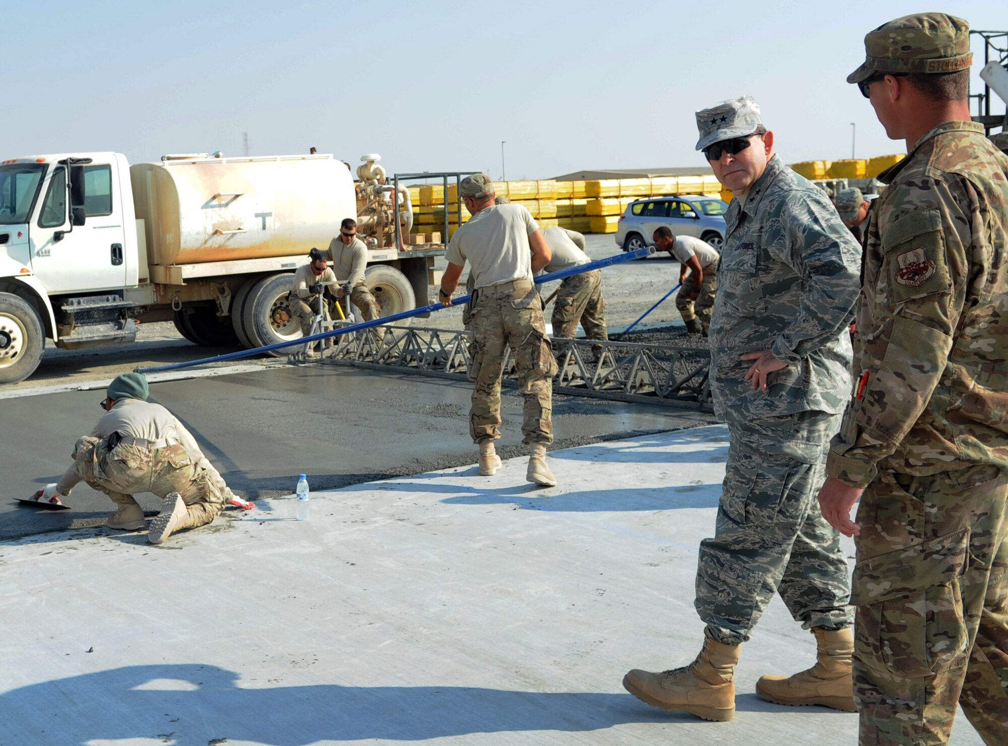 SOUTHWEST ASIA - Maj. Gen. Timothy Byers visits with Airmen during a tour of the 380th Air Expeditionary Wing Jan. 26, 2012. The Airmen, part of a Rapid Engineer Deployable Heavy Operational Repair Squadron Engineers, or RED HORSE, unit are constructing storage facilities for the wing. Byers is the Air Force Civil Engineer. (U.S. Air Force photo/Staff Sgt. J.G. Buzanowski)