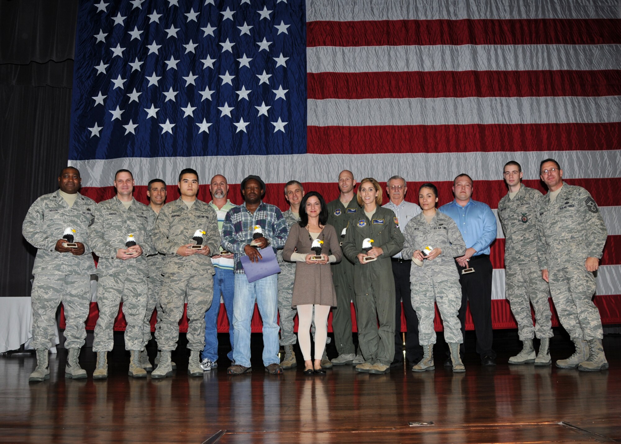 The 2011 fourth quarterly award winners or their representatives hold for a photo on stage at Kaye Auditorium Jan. 24. (U.S. Air Force photo/Melissa Doublin)