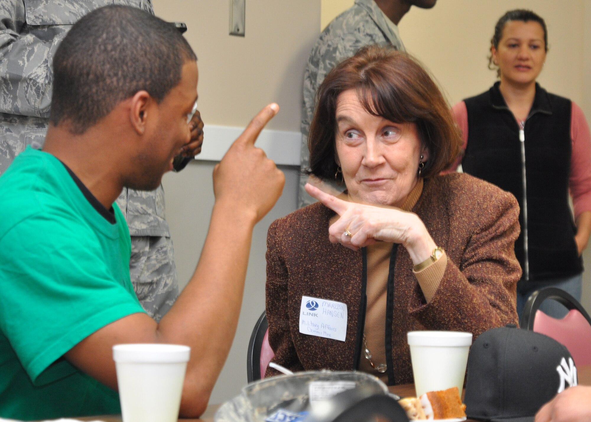 Marleen Hansen, a member of the Military Affairs Committee and Columbus Air Force Base enlisted dorm resident, bond over being from the same hometown at the dorm dinner sponsored by the MAC on Jan.19th. The MAC Committee, a part of The Columbus-Lowndes Development, also known as LINK, worked with the "Top 3" and senior base members to pull together an Italian-themed meal for the enlisted dorm residents on Columbus AFB. (U.S. Air Force photo/2nd Lt. Brionna Ruff)