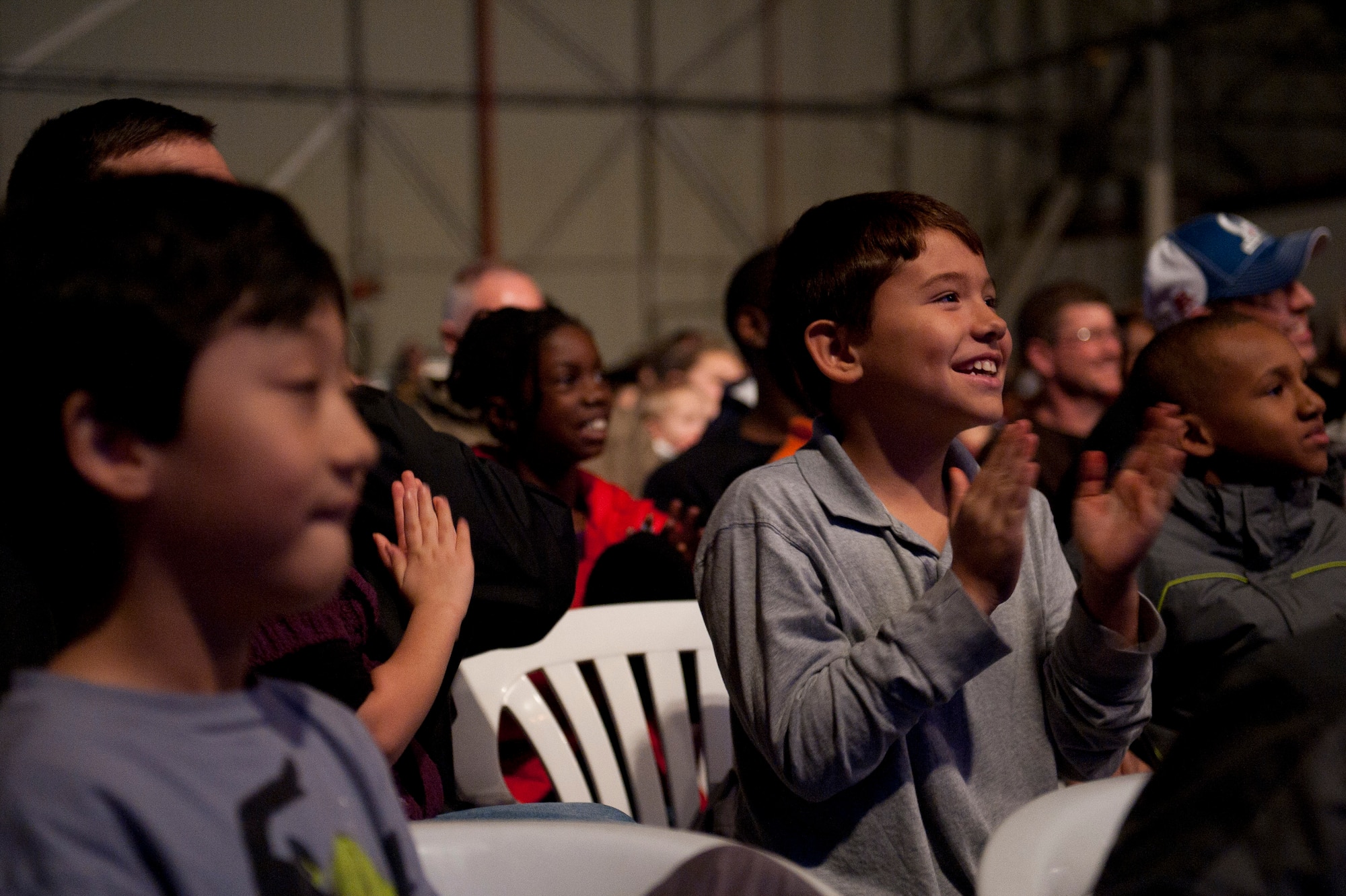 Audience members cheer during a Cirque Dreams World Tour performance Jan. 30, 2012, at Incirlik Air Base, Turkey. Cirque Dreams partnered with Armed Forces Entertainment to perform "Jungle Fantasy" at 17 military installations in 10 different countries through Asia and Europe. (U.S. Air Force photo by Tech. Sgt. Michael B. Keller/Released)