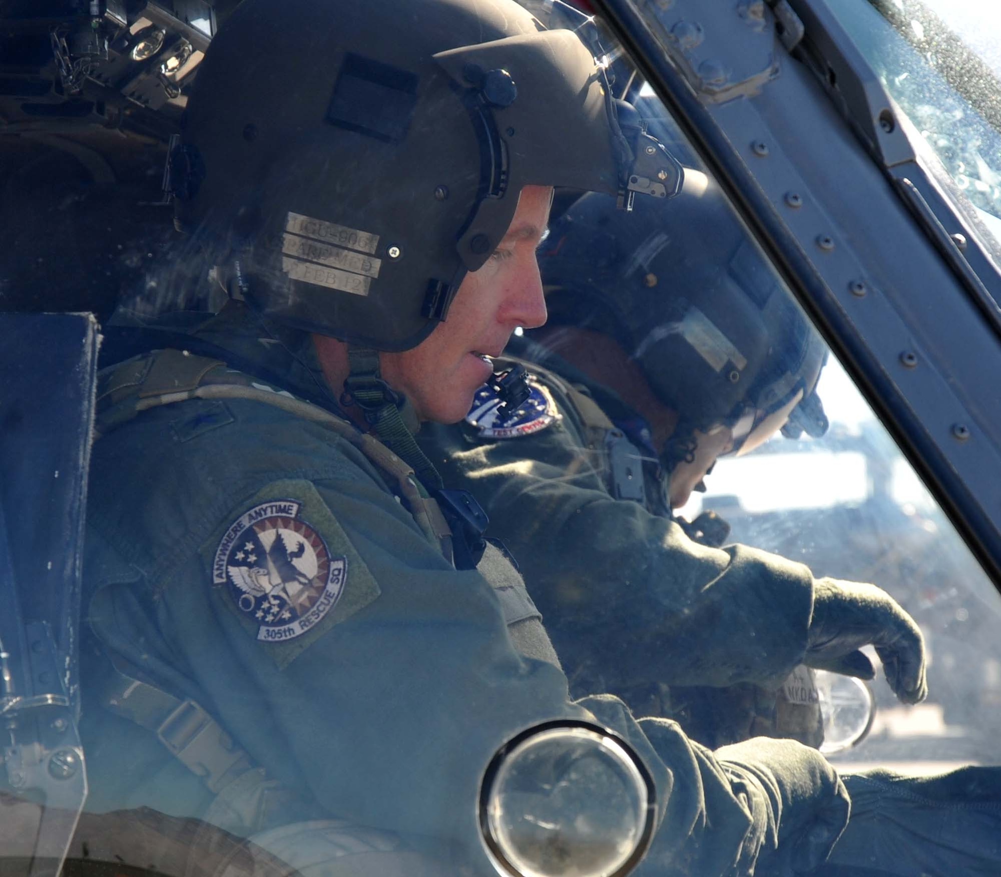 Brig. Gen. William Binger, 10th Air Force commander, performs pre-flight checks prior to his familiarization flight in an HH-60 Pave Hawk helicopter. General Binger visited the 943rd Rescue Group at Davis-Monthan Air Force Base, Ariz., to learn about the combat-search-and-rescue mission and the Air Force Reserve units based there. (U.S. Air Force Photo/ Master Sgt. Luke Johnson)
