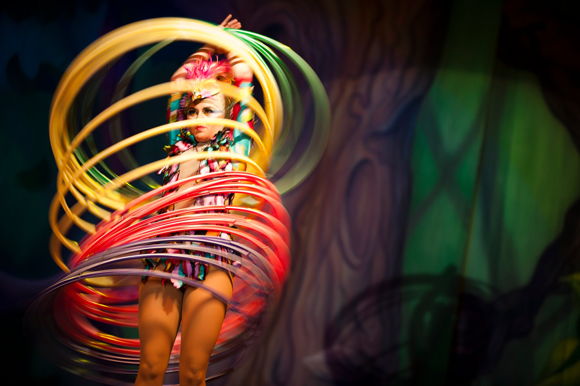 A cast member whirls hoops during a Cirque Dreams World Tour performance Jan. 30, 2012, at Incirlik Air Base, Turkey. Cirque Dreams partnered with Armed Forces Entertainment to perform "Jungle Fantasy" at 17 military installations in 10 different countries through Asia and Europe. (U.S. Air Force photo by Tech. Sgt. Michael B. Keller/Released)