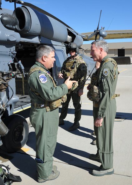 Lt. Col. Jeffery Peterson, Air National Guard and Air Force Reserve Test Center, explains the flight characteristics of the HH-60 Pave Hawk helicopter prior to Brig.
Gen. William Binger's familiarization flight. General Binger visited for the first time as 10th Air Force commander to learn about the mission of the 943rd Rescue Group and visit with Reserve Airmen stationed at Davis-Monthan Air Force Base, Ariz. (U.S. Air Force Photo/ Master Sgt. Luke Johnson)