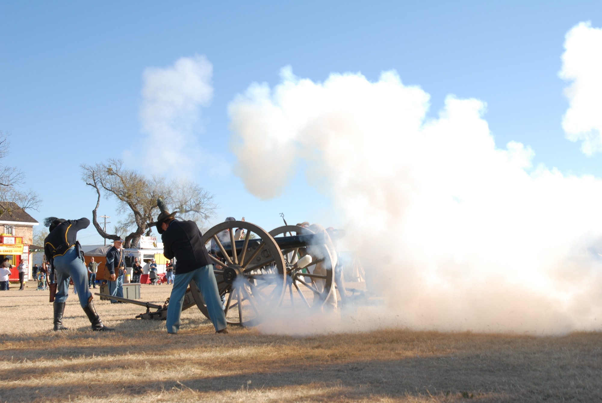 SAN ANGELO, Texas-- Re-enactors from Fort Concho, a historical Army fort dating before the Civil War, fire a cannon from that time period. The unusual "Buffalo Soldiers" nickname was given to the black troops of the frontier west by the Northern Plains Indians after the Civil War, some of whom were stationed at this site. (Courtesy photo)  

