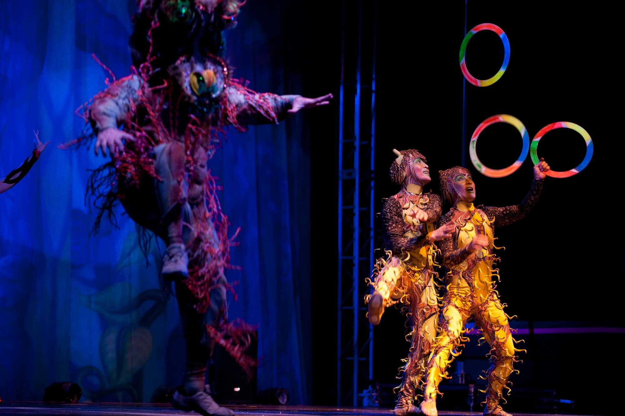 Cast members juggle during a Cirque Dreams World Tour performance Jan. 30, 2012, at Incirlik Air Base, Turkey. Cirque Dreams partnered with Armed Forces Entertainment to perform "Jungle Fantasy" at 17 military installations in 10 different countries through Asia and Europe. (U.S. Air Force photo by Tech. Sgt. Michael B. Keller/Released)