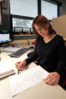 Kathryn Harshberger earned the title of 4th Fighter Wing 2011 Appropriated Fund Sr. Civilian of the Year during a ceremony at Seymour Johnson Air Force Base, N.C., Jan. 28, 2012. Harshberger works at the 4th Contracting Squadron. (U.S. Air Force photo/Senior Airman Rae Perry)