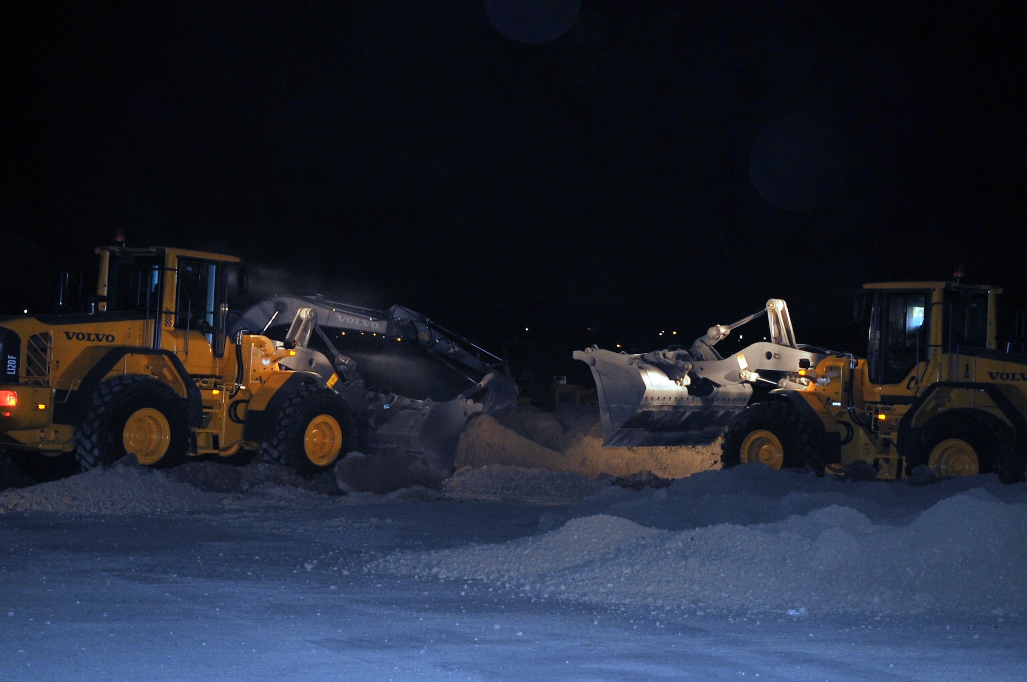 Members from the 51st Civil Engineer Squadron respond to a simulated crater in the runway. Their mission is to restore the flight line to mission ready operations, Jan. 31, 2012. The exercise is a peninsula-wide operational readiness exercise held to train U.S. forces throughout South Korea. (U.S. Air Force photo/Staff Sgt. Craig R. Cisek)