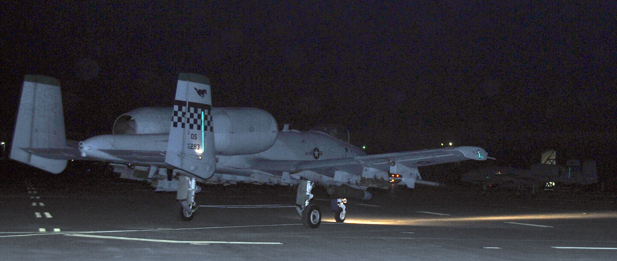 Two A-10 Thunderbolt IIs from the 51st Fighter Wing taxi onto the flight line to start the flying mission as a part of exercise Beverly Bulldog 12-01 Jan. 31,2012. The exercise is a peninsula-wide operational readiness exercise held to train U.S. forces throughout South Korea. (U.S. Air Force photo/Staff Sgt. Craig R. Cisek)