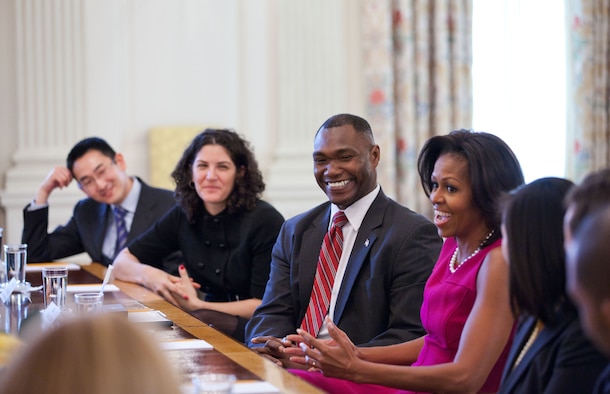 Lt. Col. Rodney Lewis joins other White House Fellows in a meeting with First Lady Michelle Obama Jan. 25, 2012, in the State Dining Room of the White House. Lewis' primary mission is to help further Obama's and Jill Biden's Joining Forces program, which is a national initiative that mobilizes all sectors of society to give service members and their families support. (Official White House photo/Sonya N. Hebert)