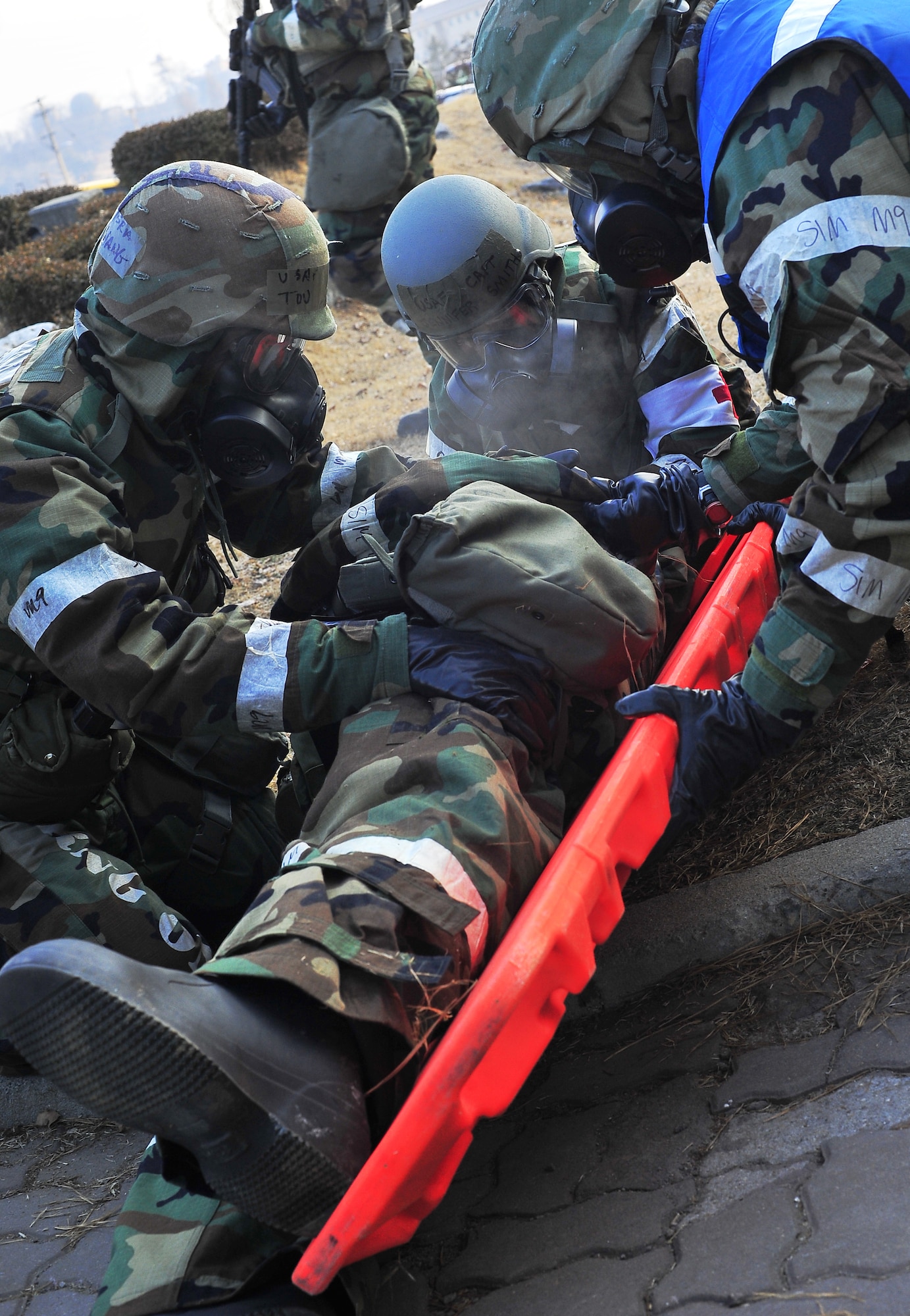 51st Medical Group members respond to a simulated bus crash accident victim during an exercise at Osan Air Base Jan. 31, 2012. Team Osan is participating in Beverly Bulldog 12-01, the first exercise of the year designed to test the base’s response during a wartime contingency. (U.S. Air Force photo/Staff Sgt. Stefanie Torres)