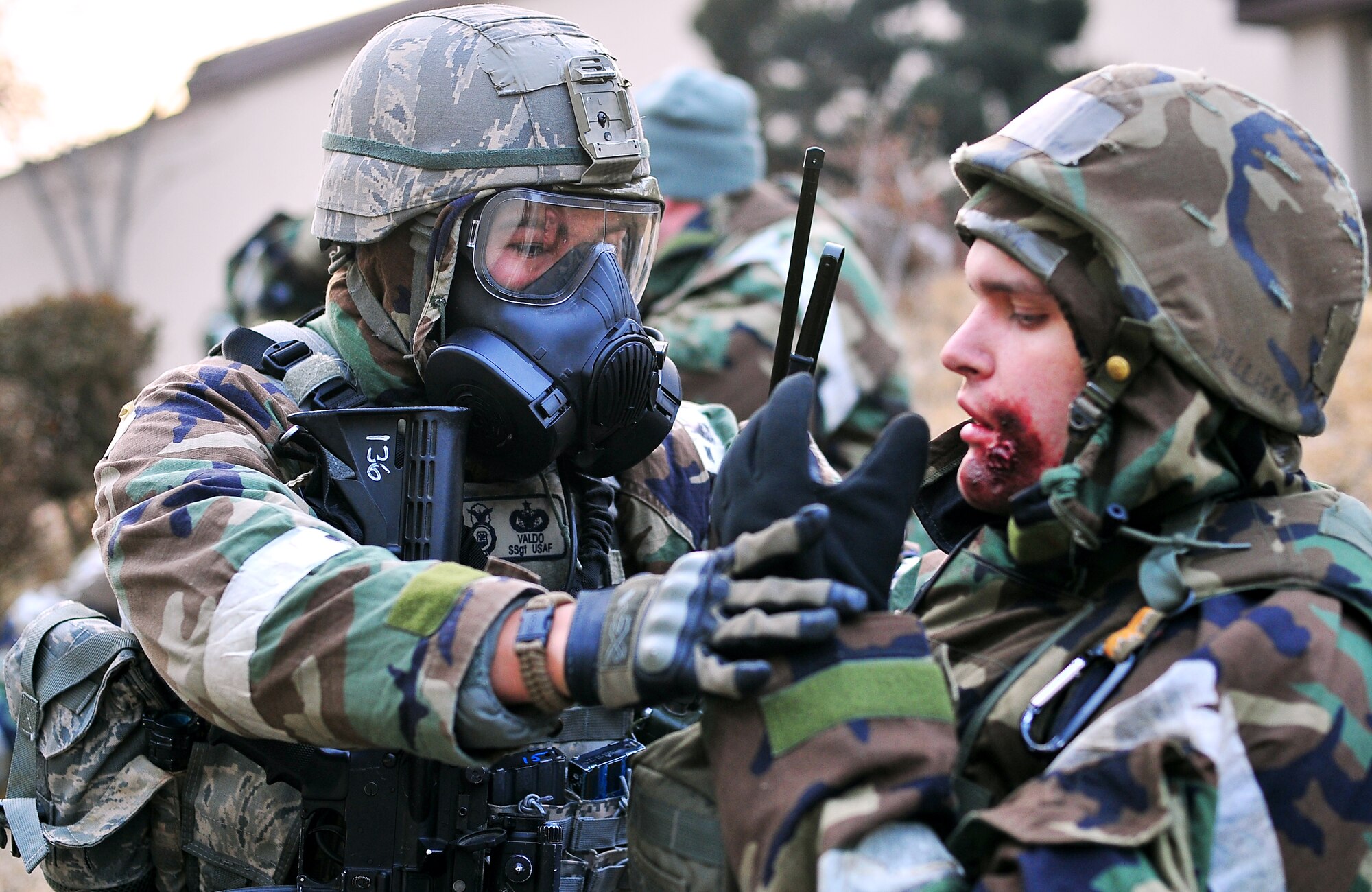 Staff Sgt. Kendrick Valdo, 51st Security Forces Squadron patrolman, assists a role player during a simulated bus crash at Osan Air Base Jan. 31, 2012. Team Osan is participating in Beverly Bulldog 12-01, the first exercise of the year designed to test the base’s response during a wartime contingency. (U.S. Air Force photo/Staff Sgt. Stefanie Torres)